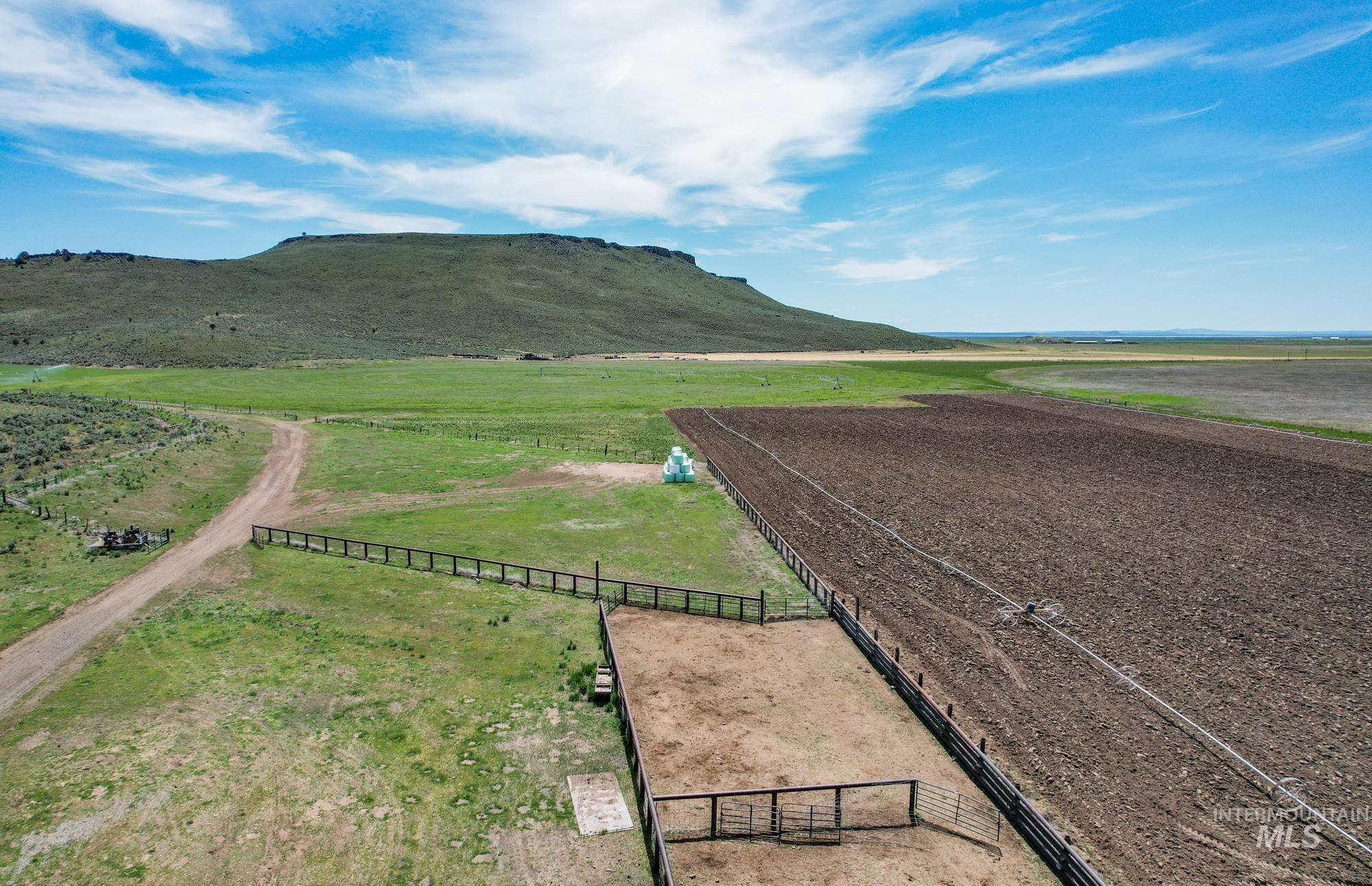 View of mountain backdrop featuring rural landscape