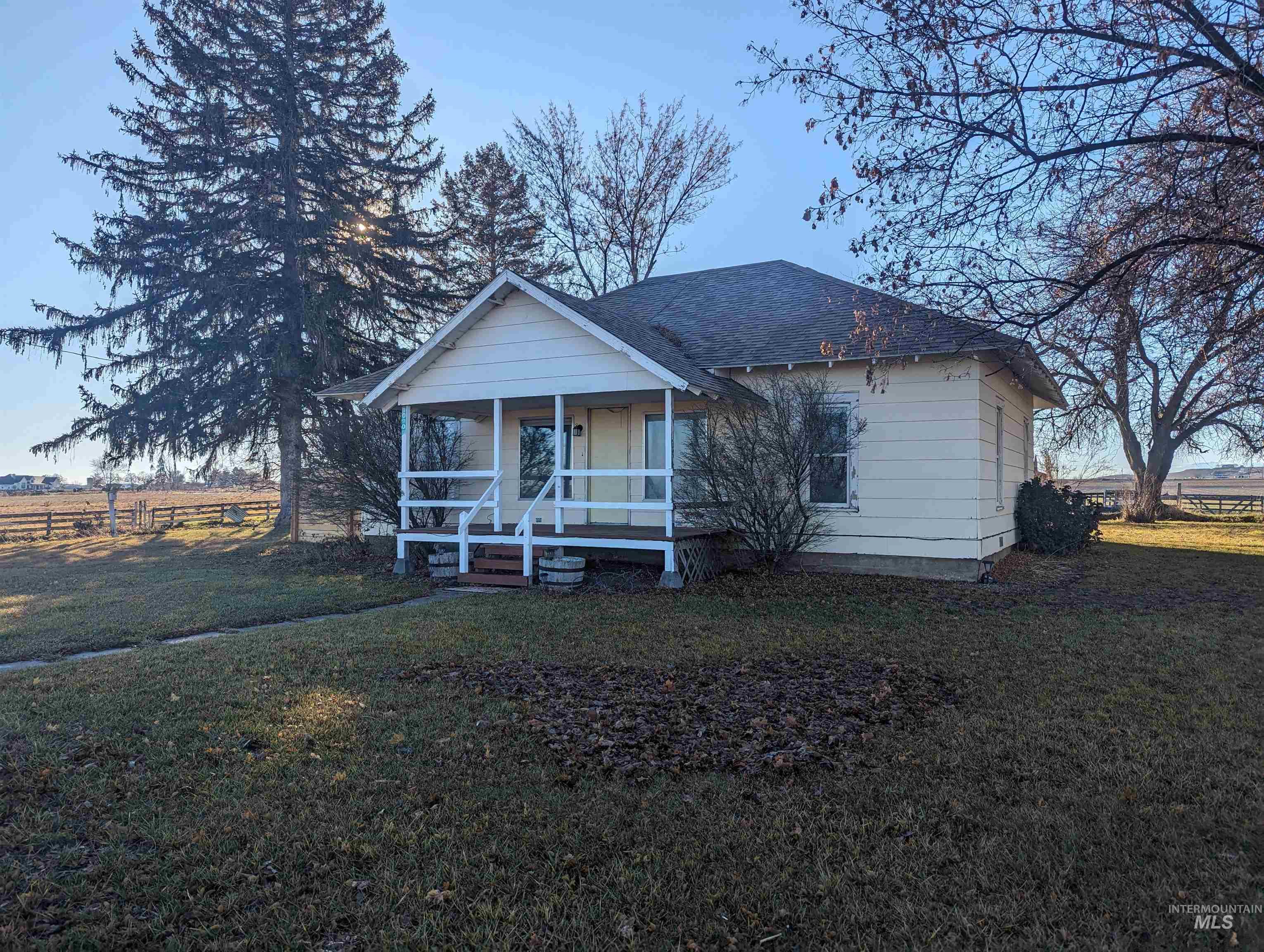 Bungalow-style house with covered porch and roof with shingles