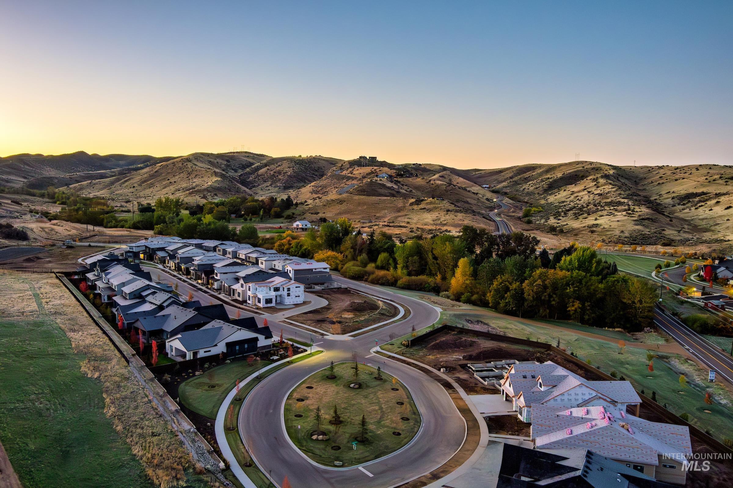 Aerial view at dusk of a residential view and a mountain view