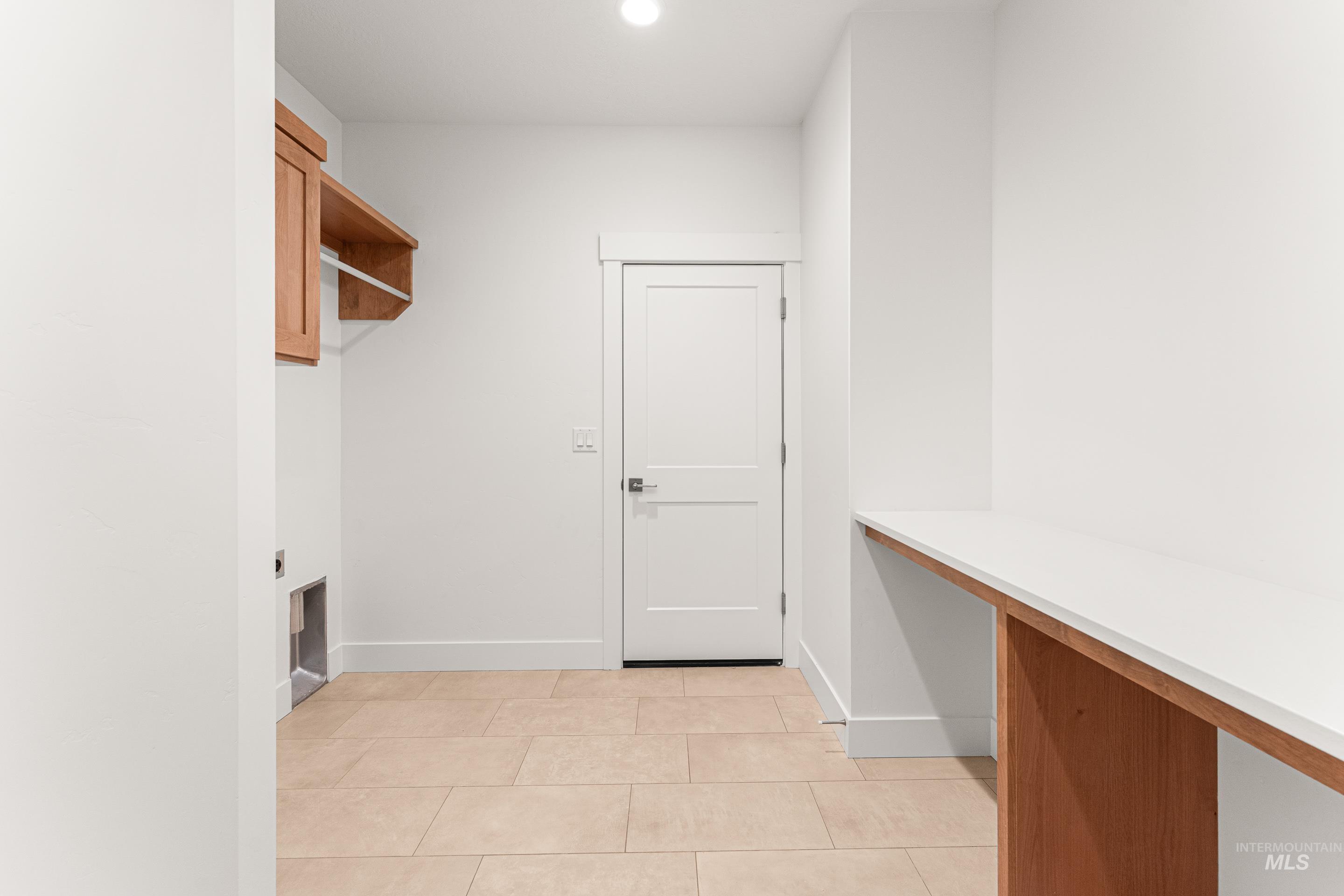 Washroom with light tile patterned floors and recessed lighting