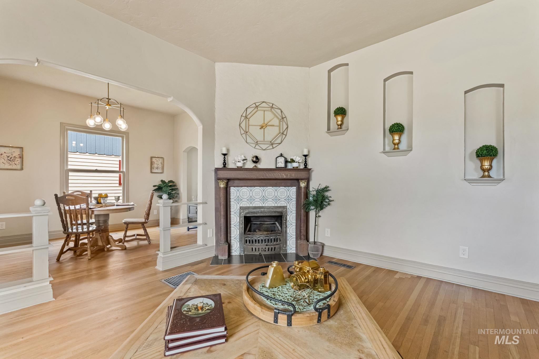 Built-in fireplace with an ornate mantel and patterned tile surround