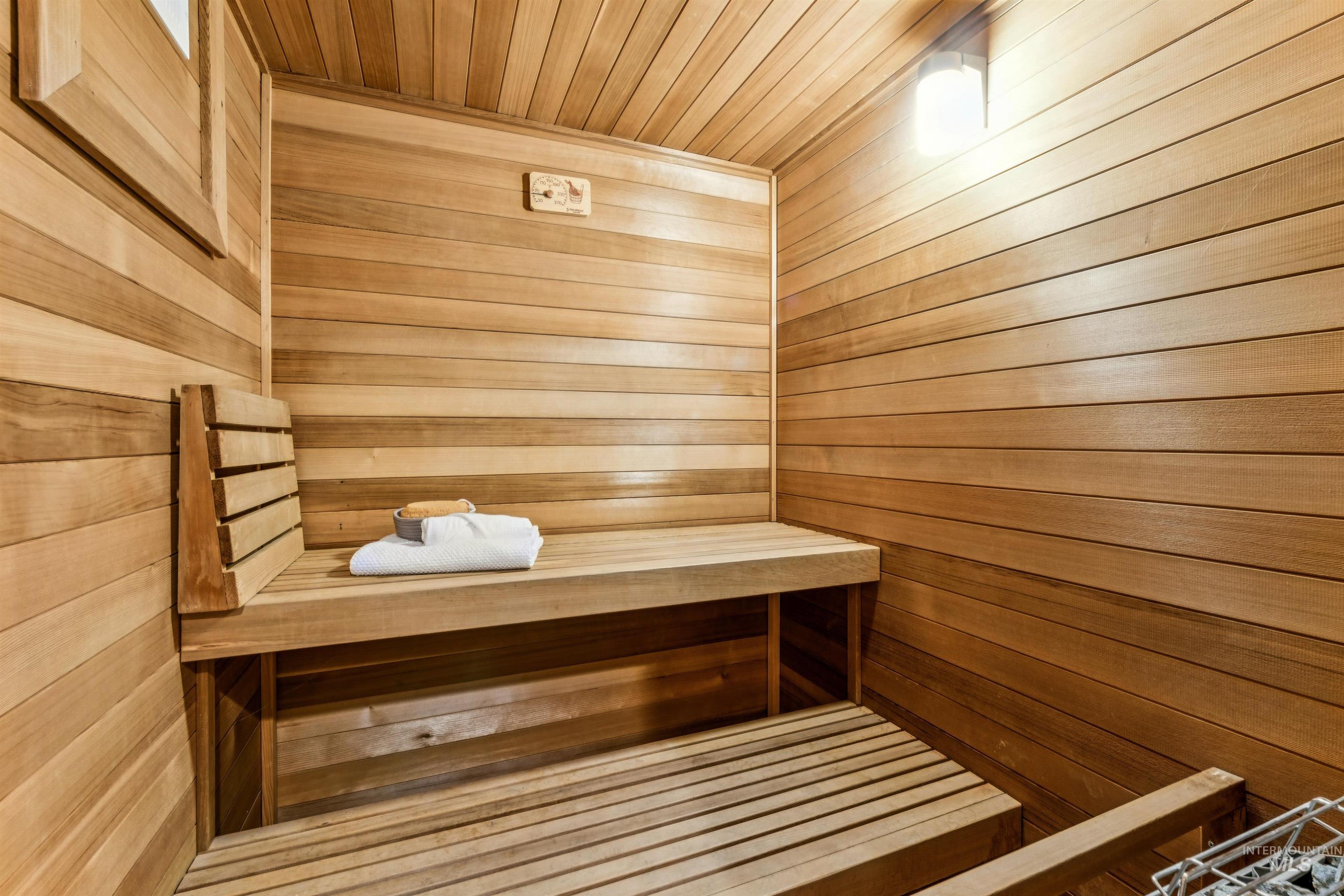 Sauna with wood ceiling and wooden walls