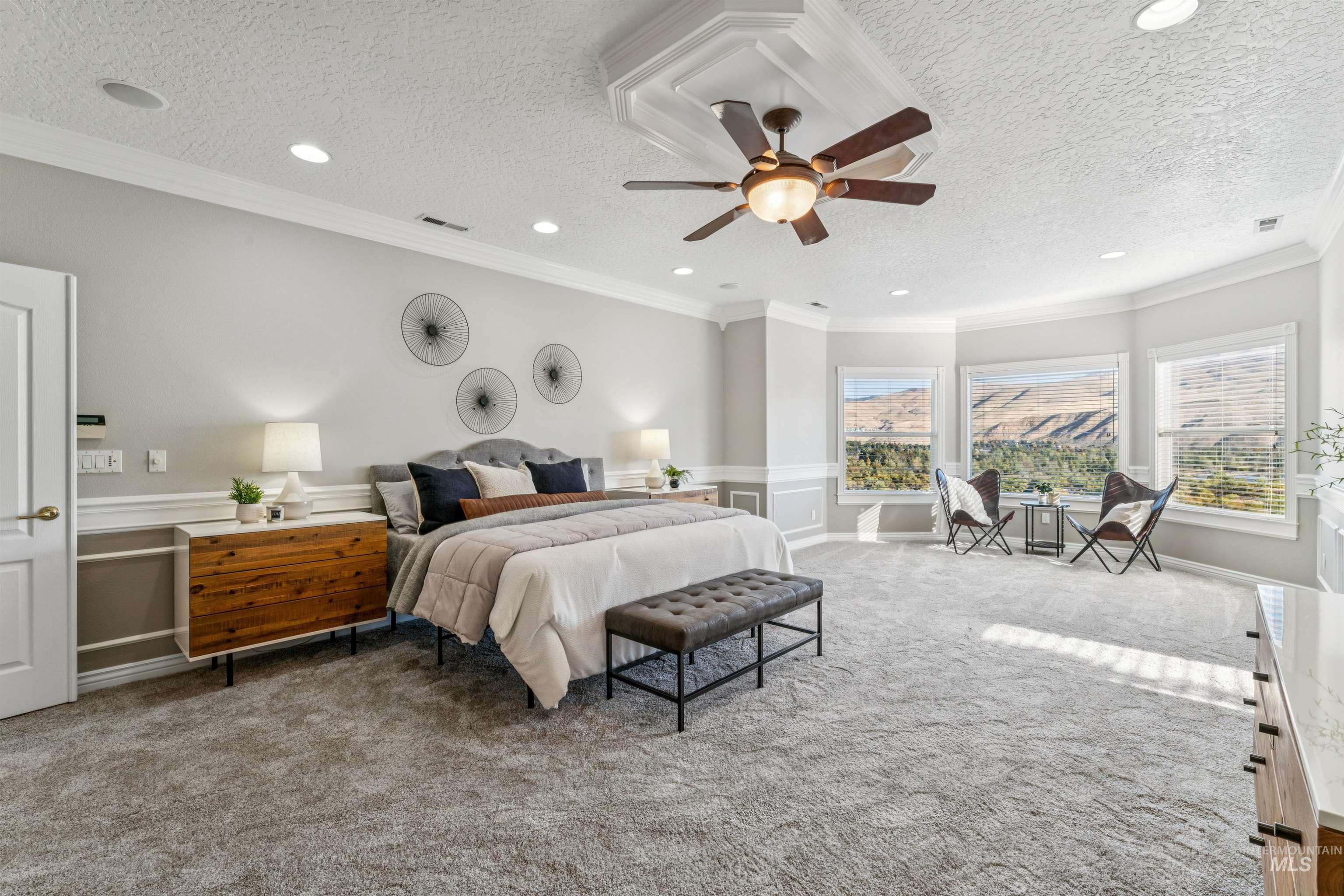 Carpeted bedroom featuring crown molding, ceiling fan, a textured ceiling, and recessed lighting