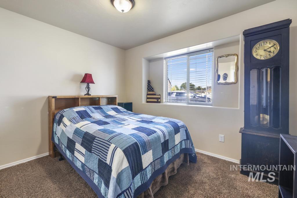 Bedroom with dark carpet