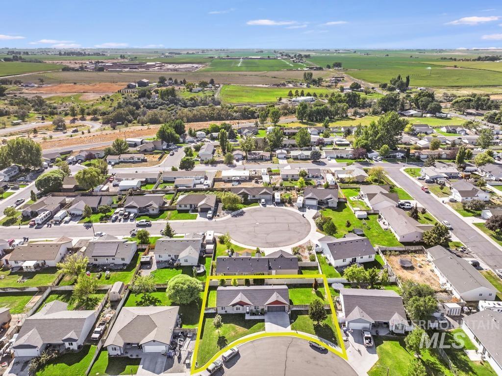 Aerial view of residential area with property parcel outlined