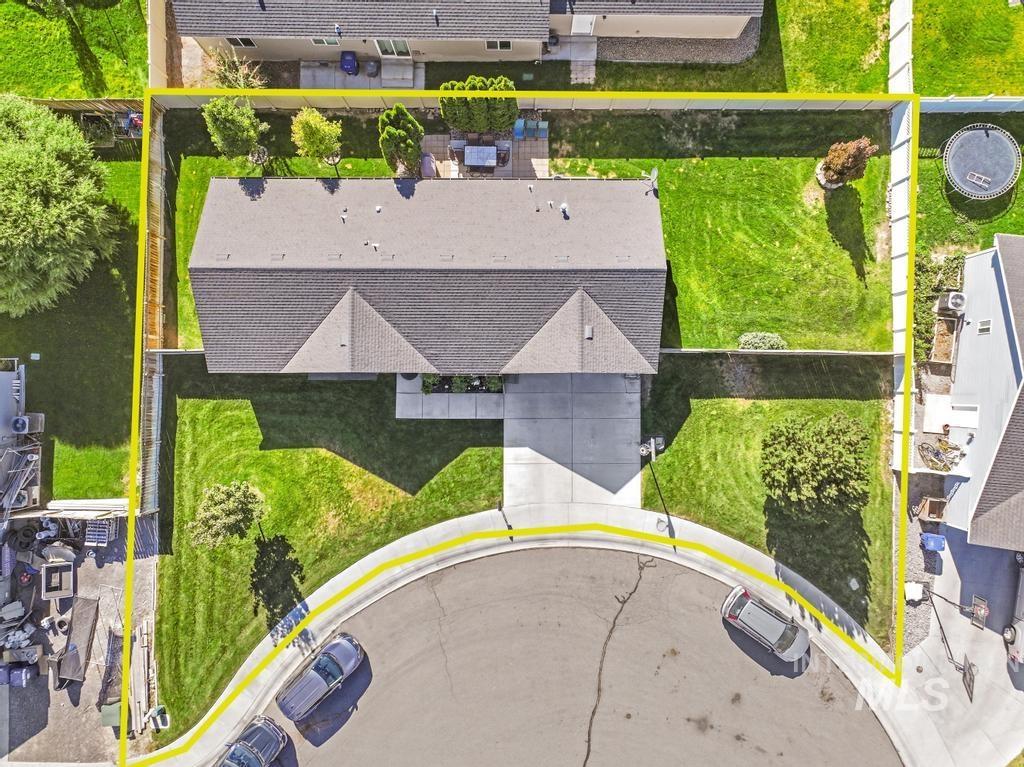 Aerial view of property and surrounding area with property parcel outlined