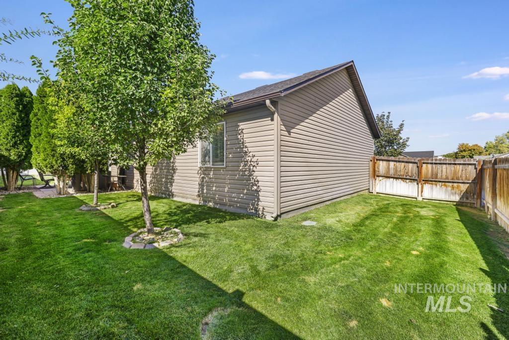 View of side of home with a fenced backyard
