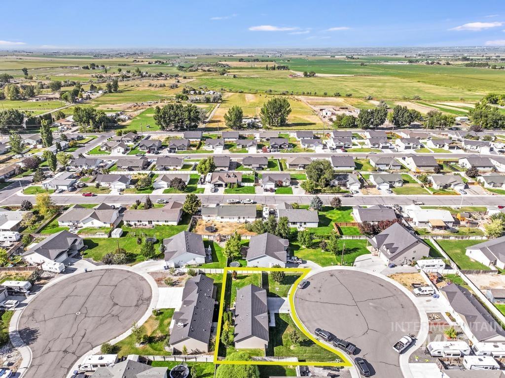 Aerial view of residential area with property parcel outlined