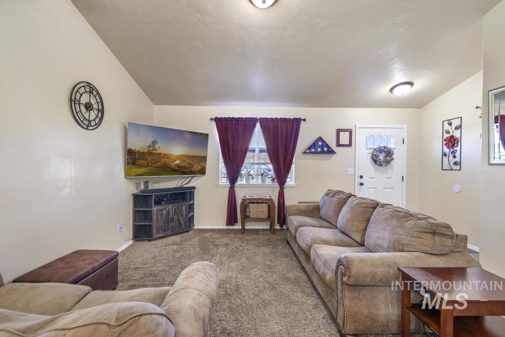 Living room with carpet and baseboards