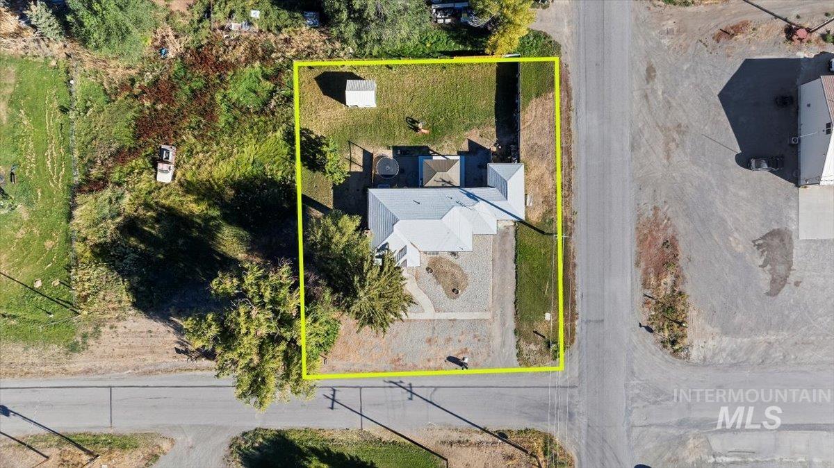 Aerial view of property and surrounding area with property boundaries highlighted