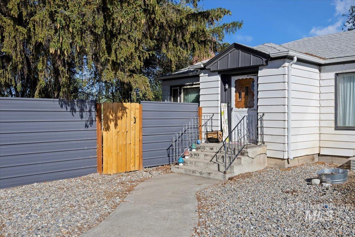 View of exterior entry featuring a gate