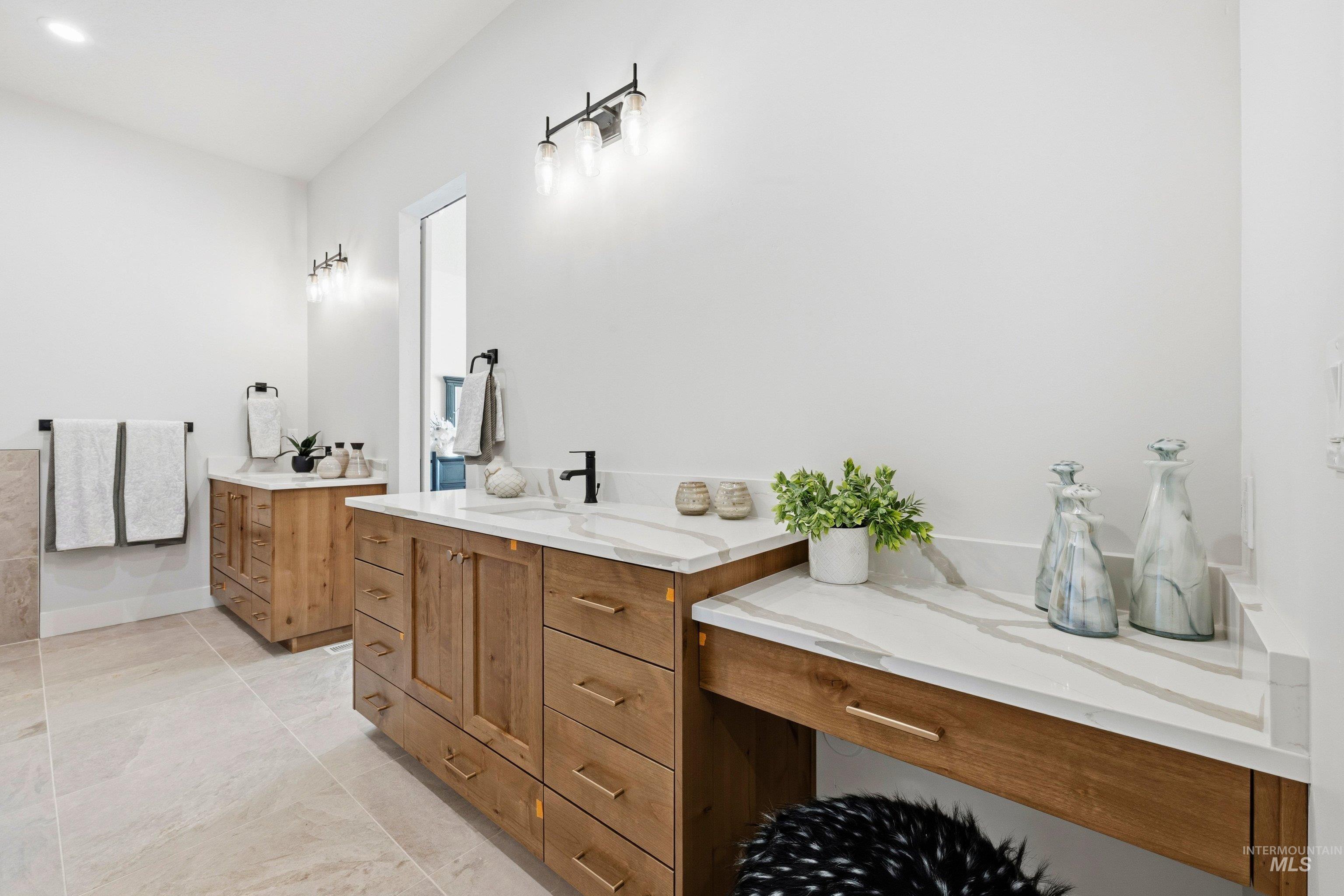 Bathroom featuring two vanities
