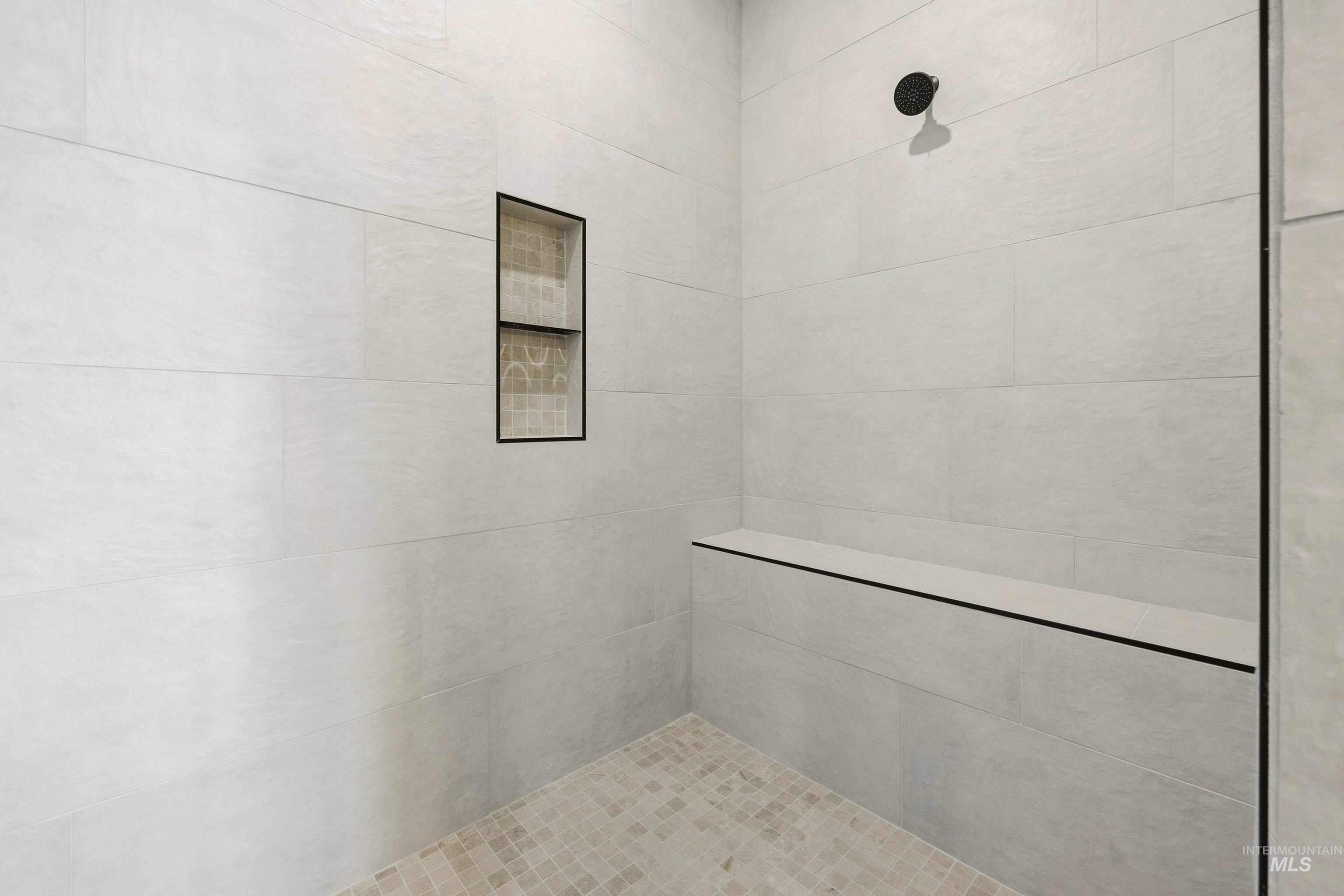 Bathroom featuring tiled shower