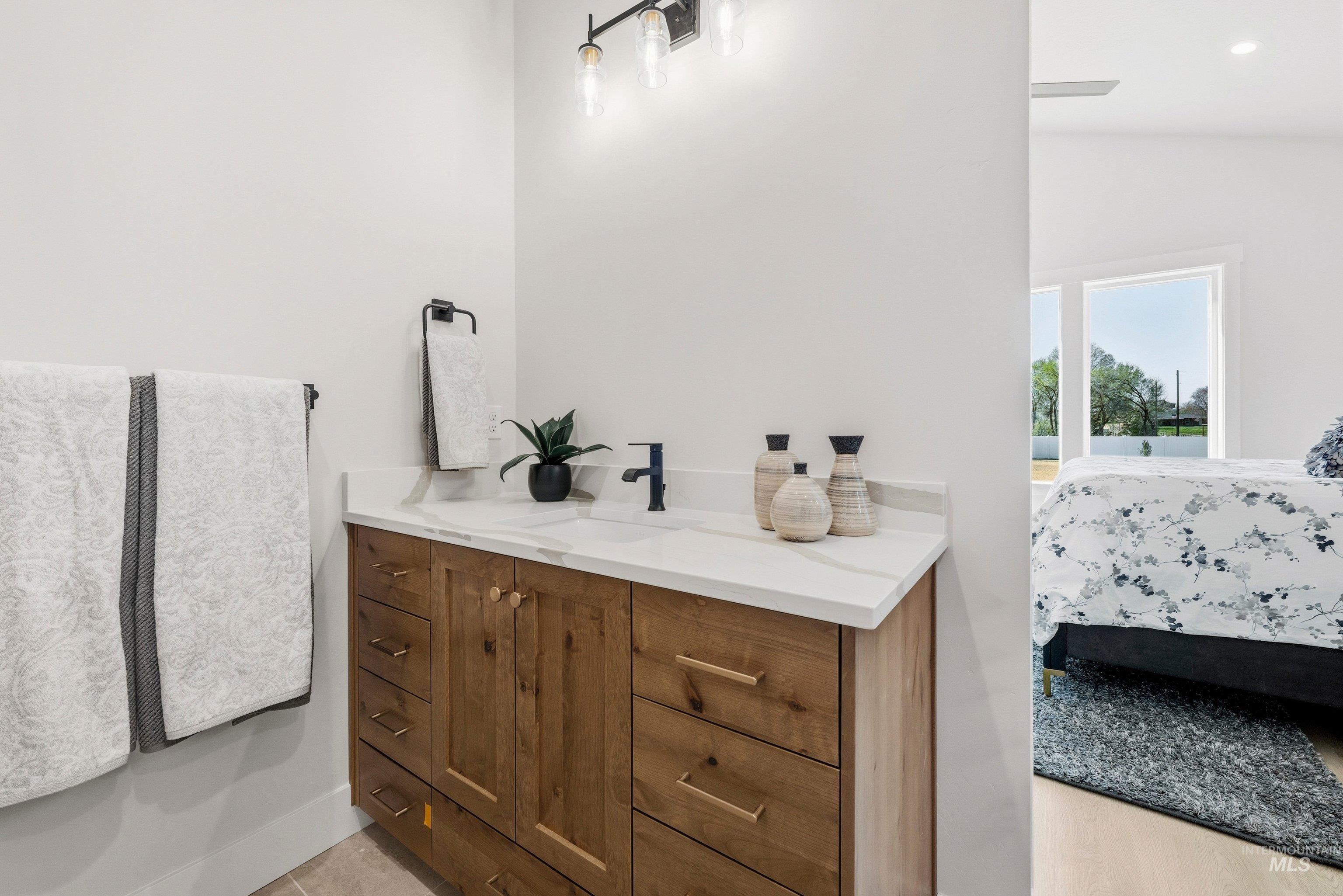 Bathroom with vanity and ensuite bathroom