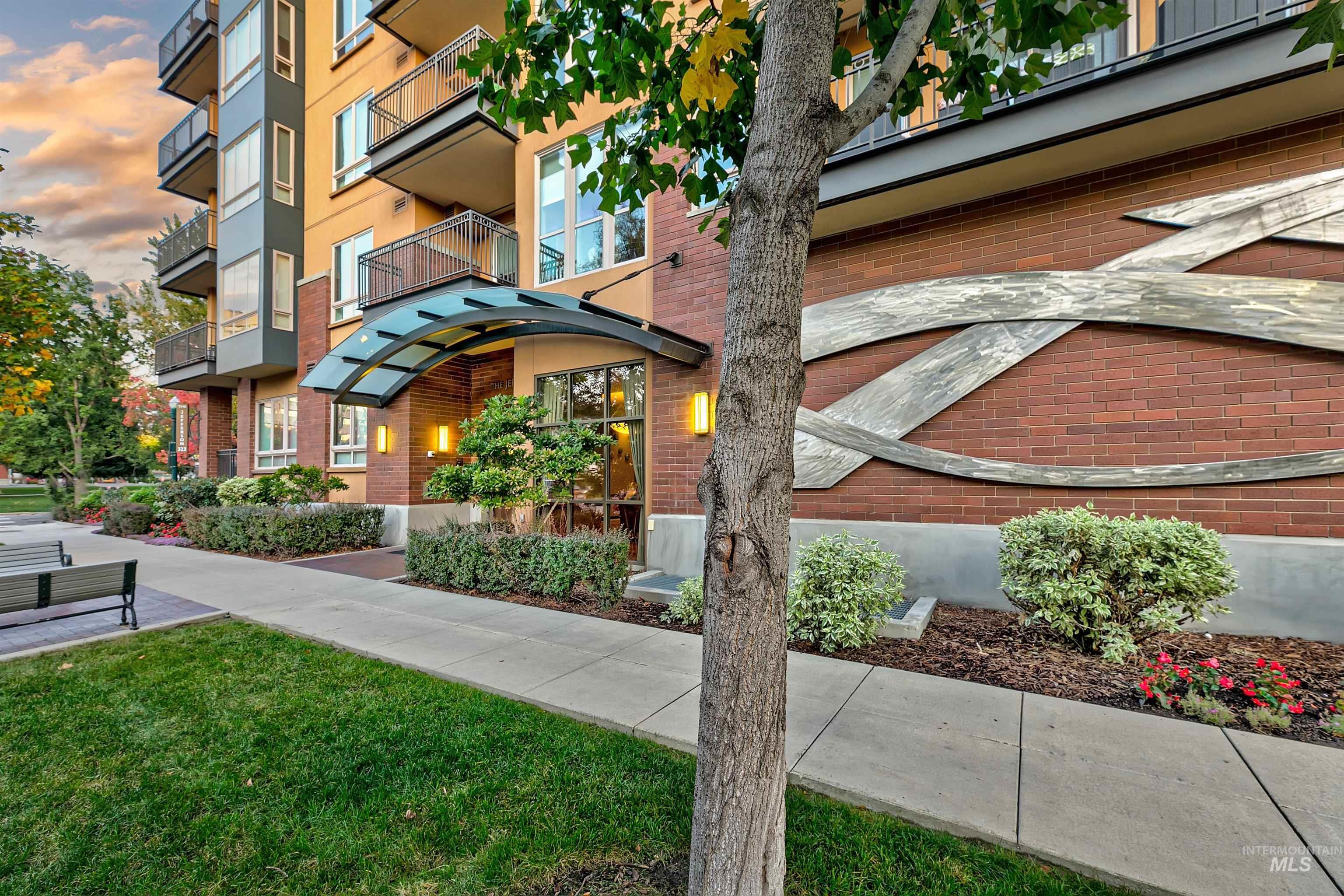View of property at dusk