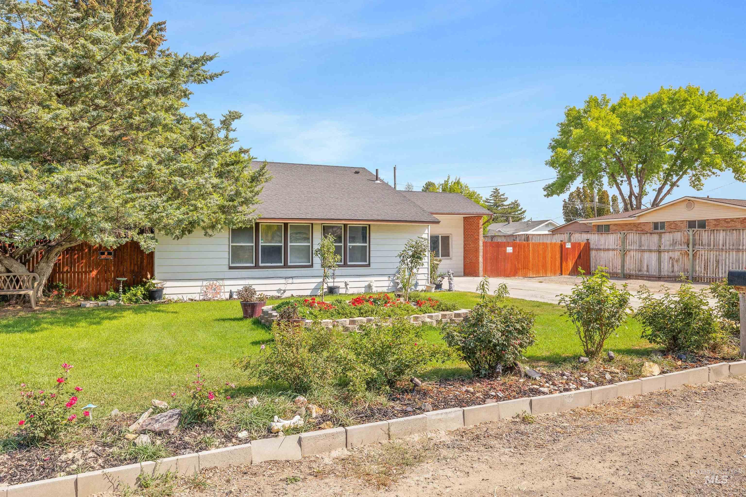 Rear view of house with a shingled roof