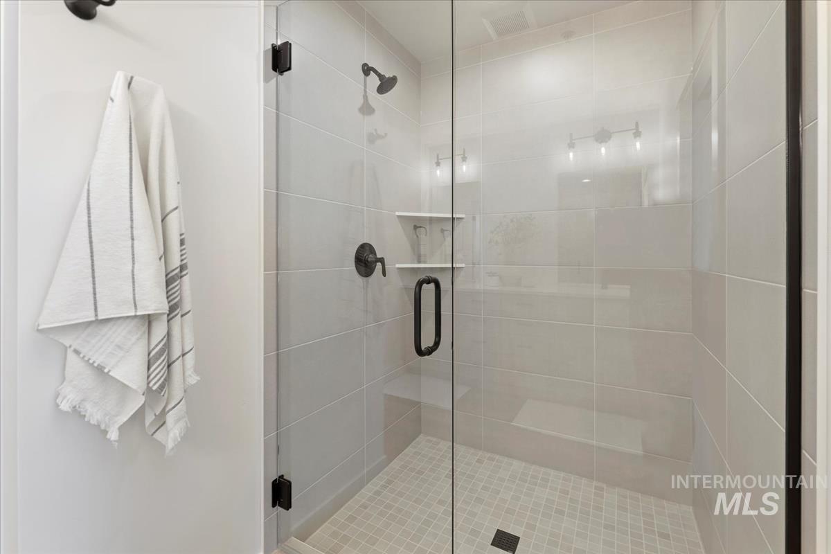 Full bathroom with a shower stall
