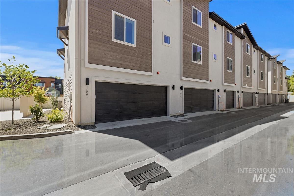 View of property featuring an attached garage