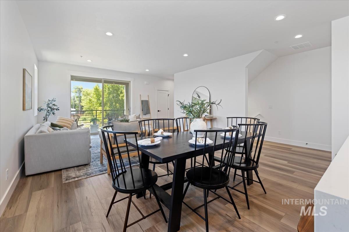 Dining area featuring recessed lighting and light wood-style floors