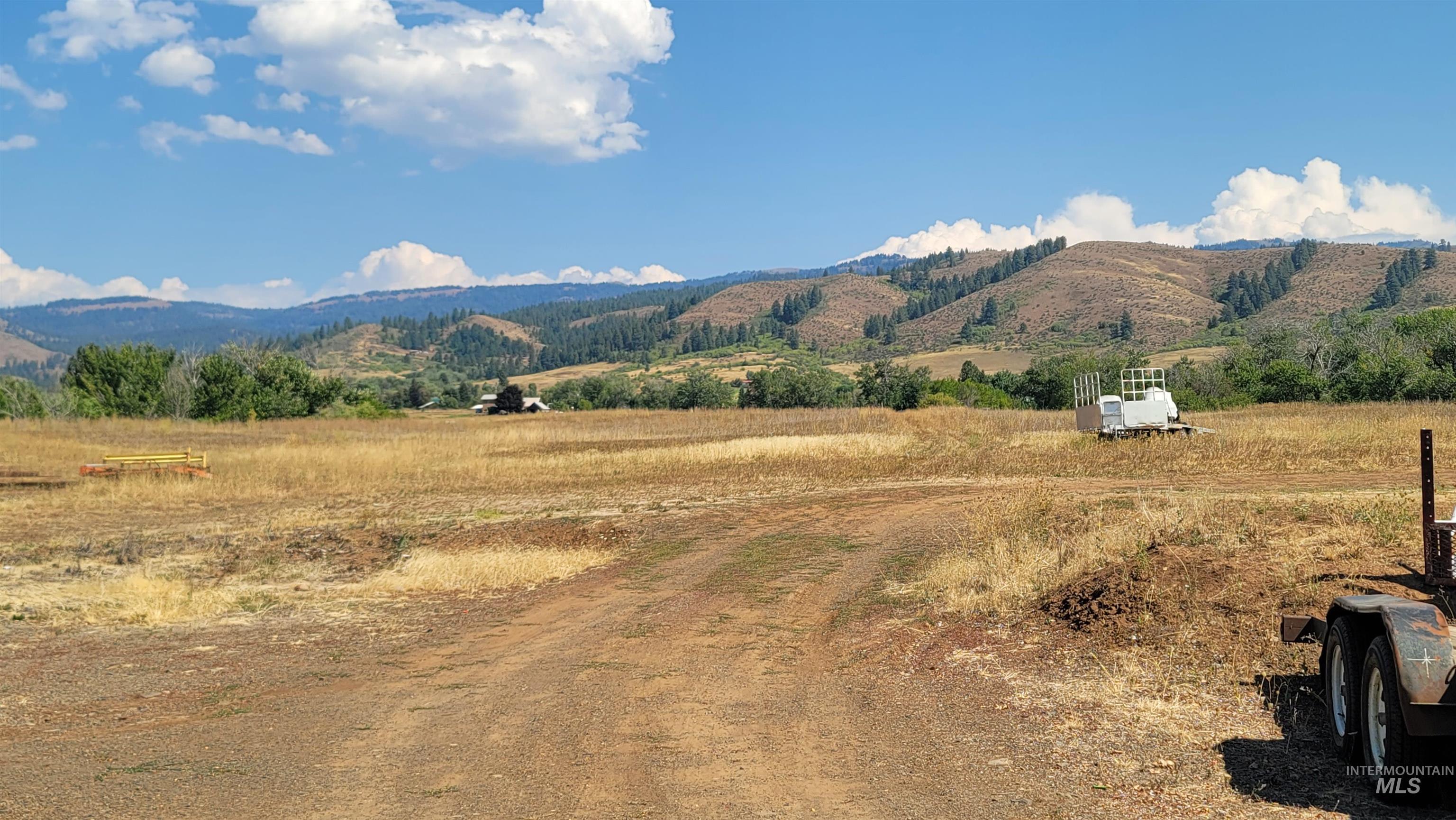 View of mountain backdrop with rural landscape