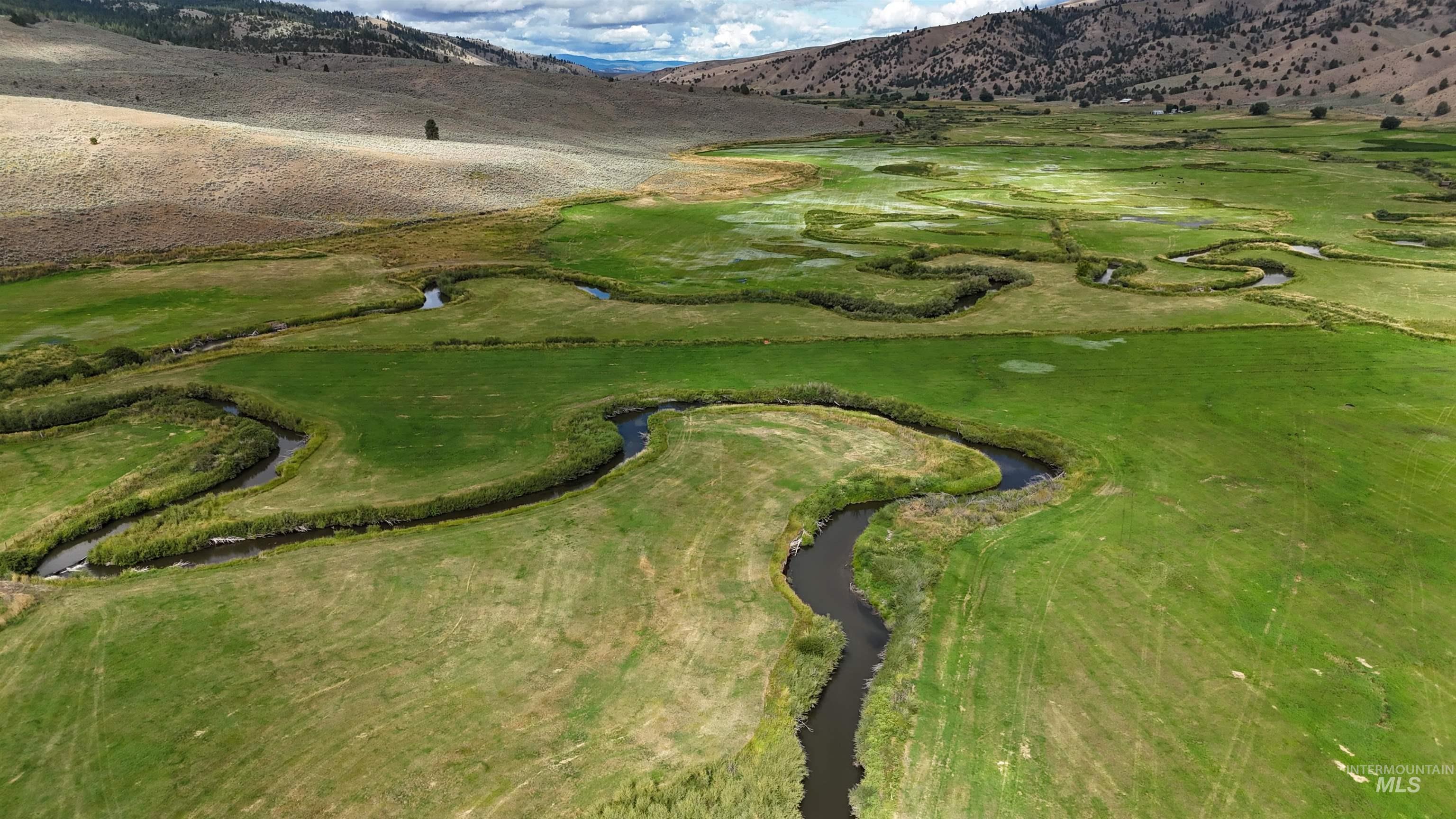 Aerial view of property's location with a mountainous background