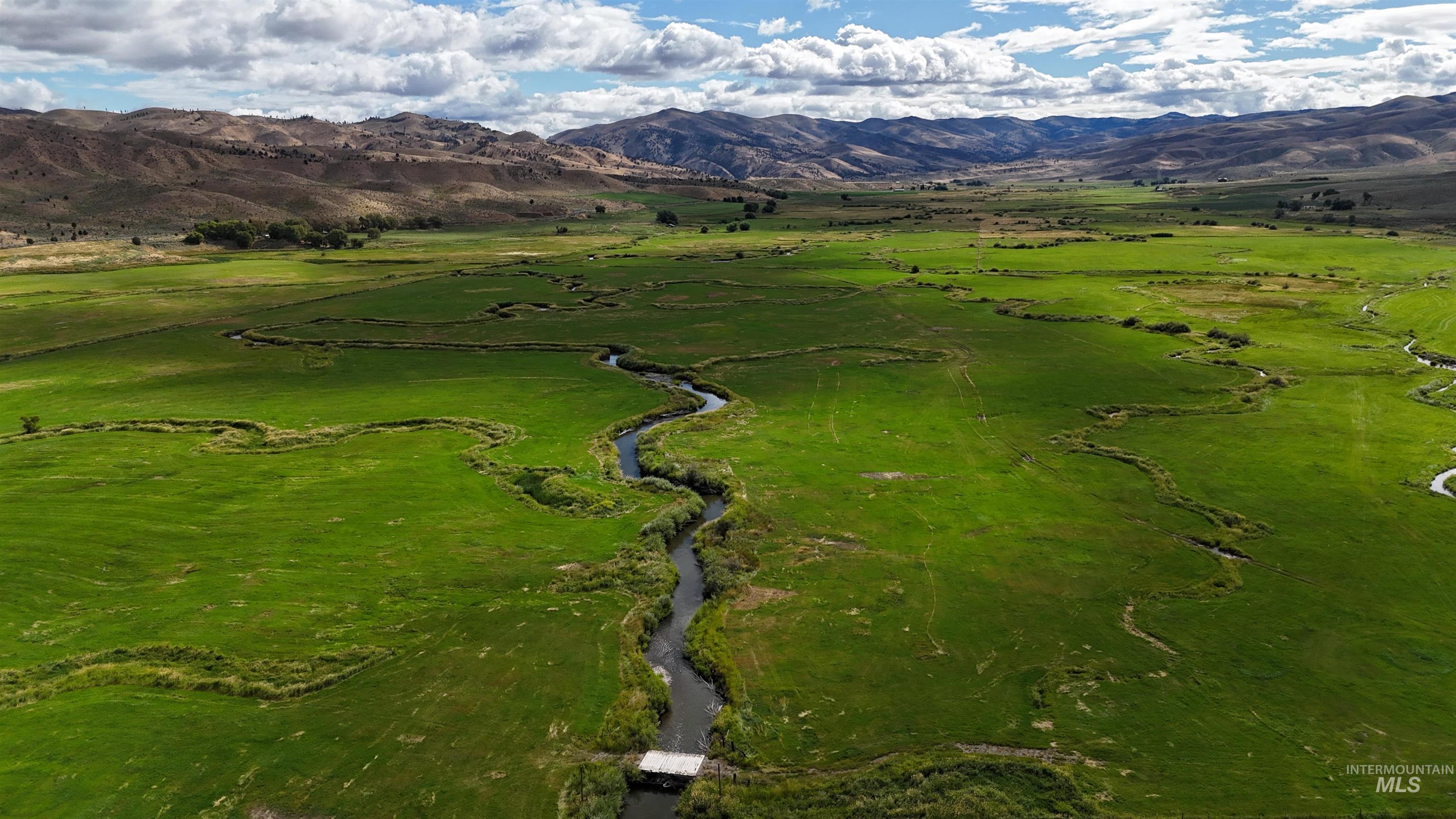 View of property location featuring a mountainous background and rural landscape