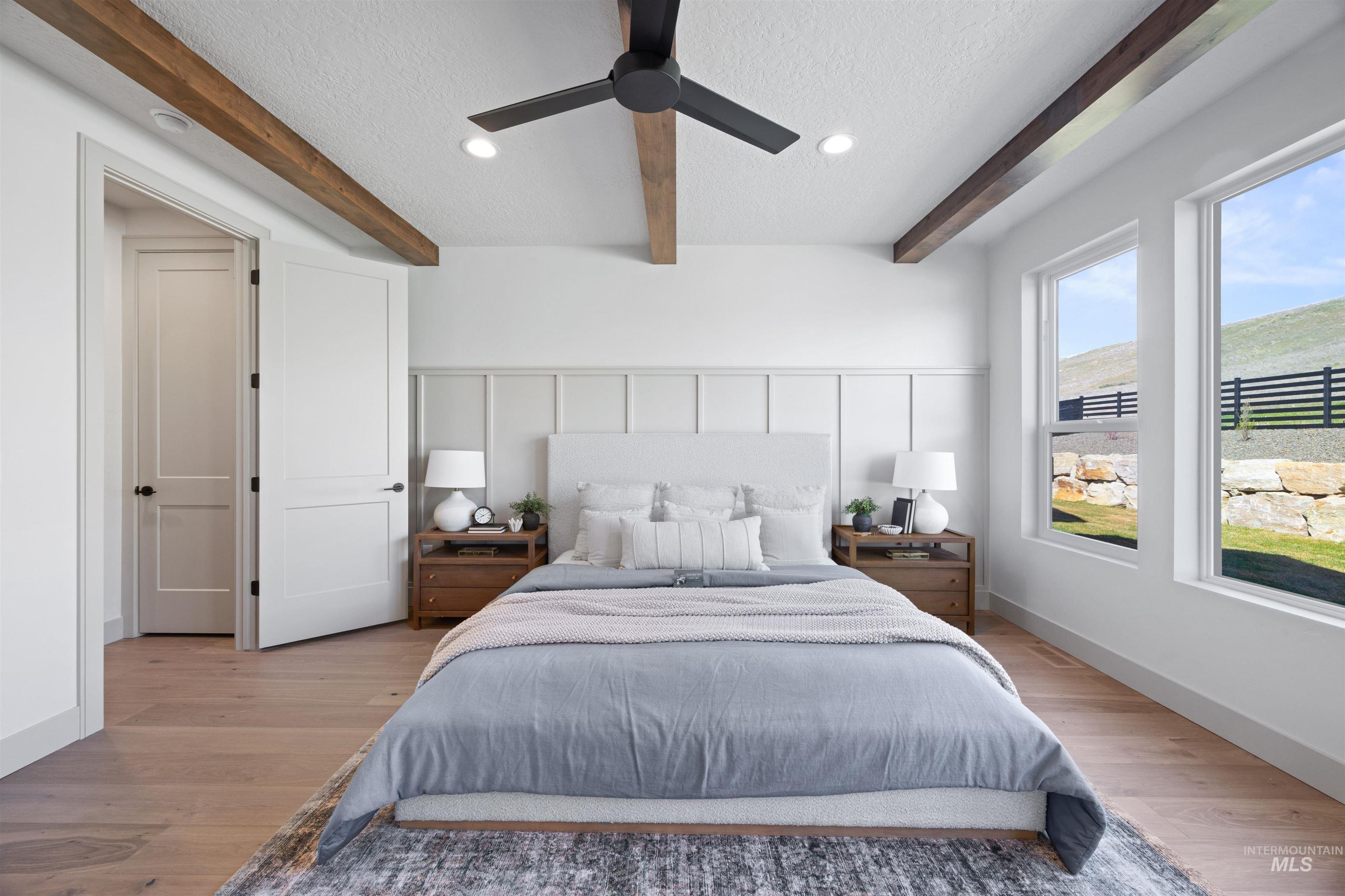 Bedroom with a textured ceiling, light wood-style flooring, a ceiling fan, beam ceiling, and recessed lighting