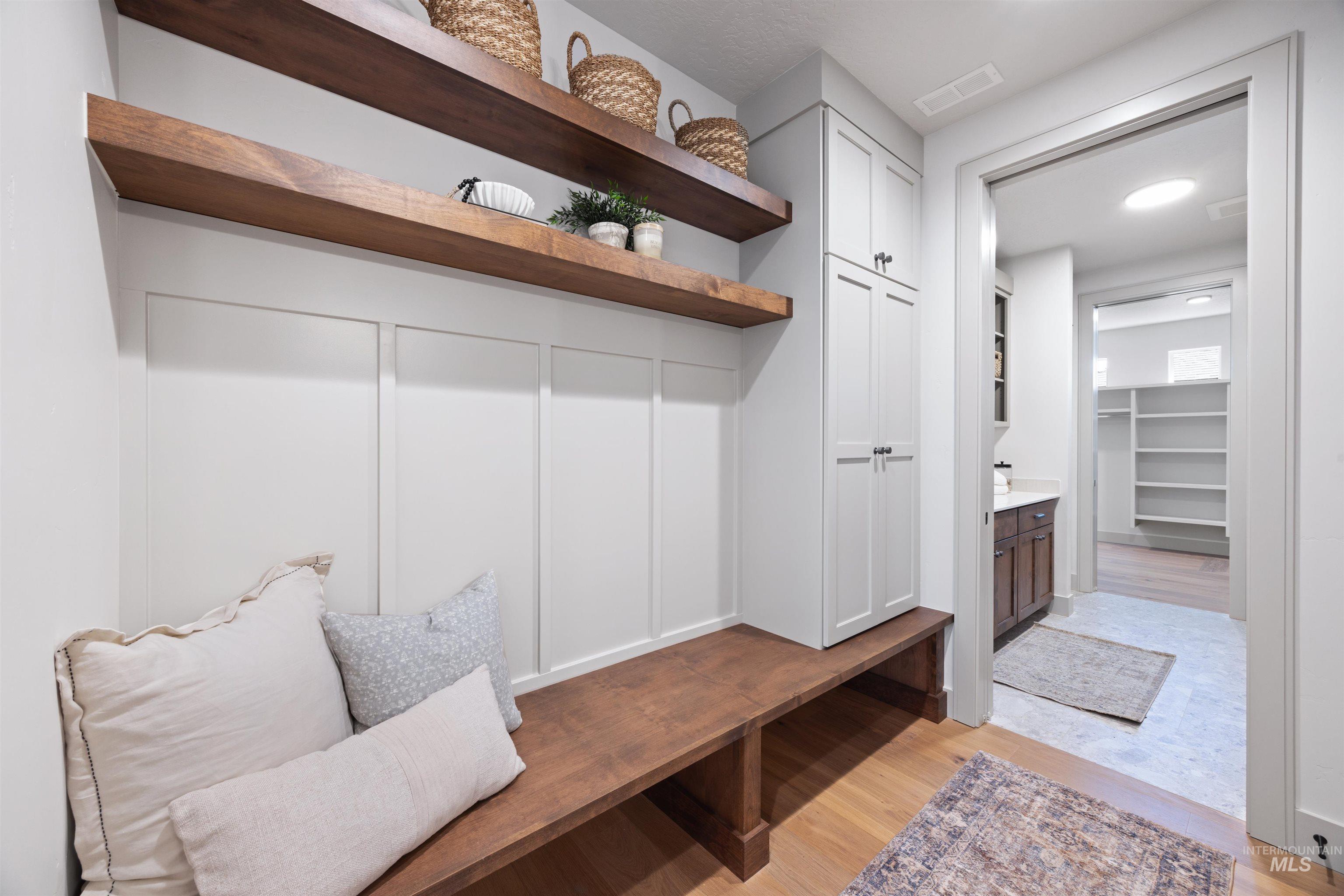Mudroom featuring light wood-style floors