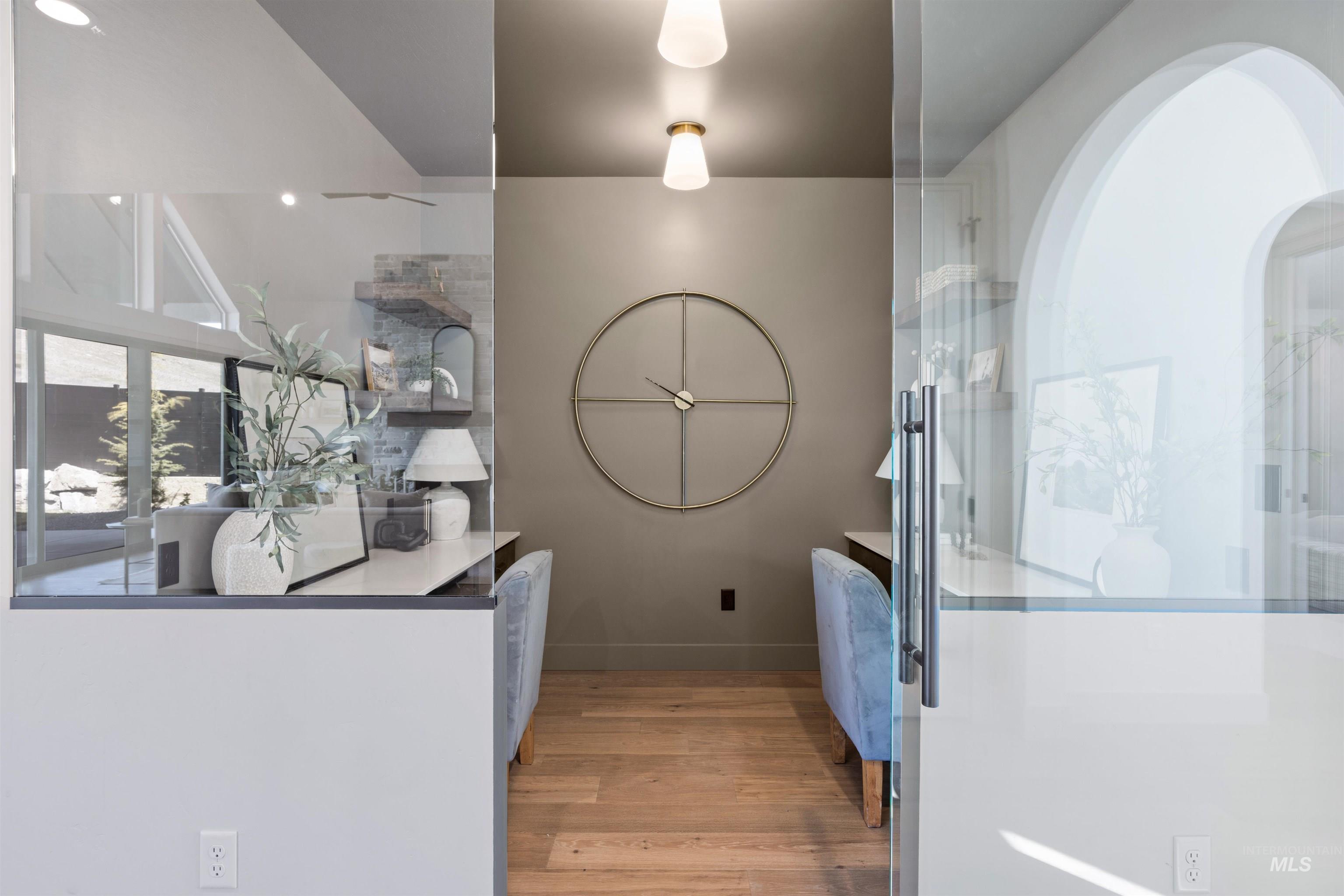 Kitchen featuring light wood-style floors and baseboards