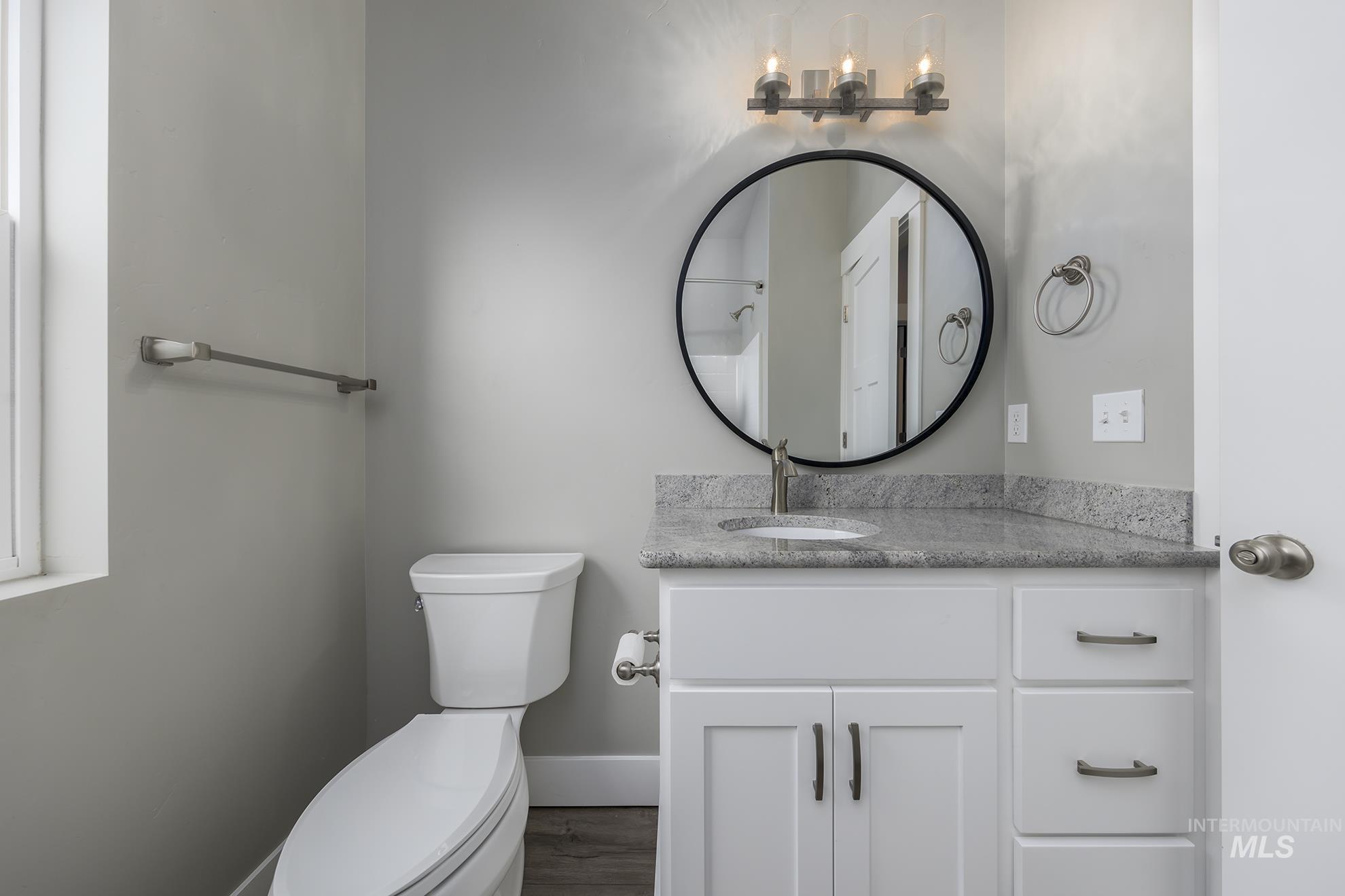 Bathroom with vanity and dark wood finished floors