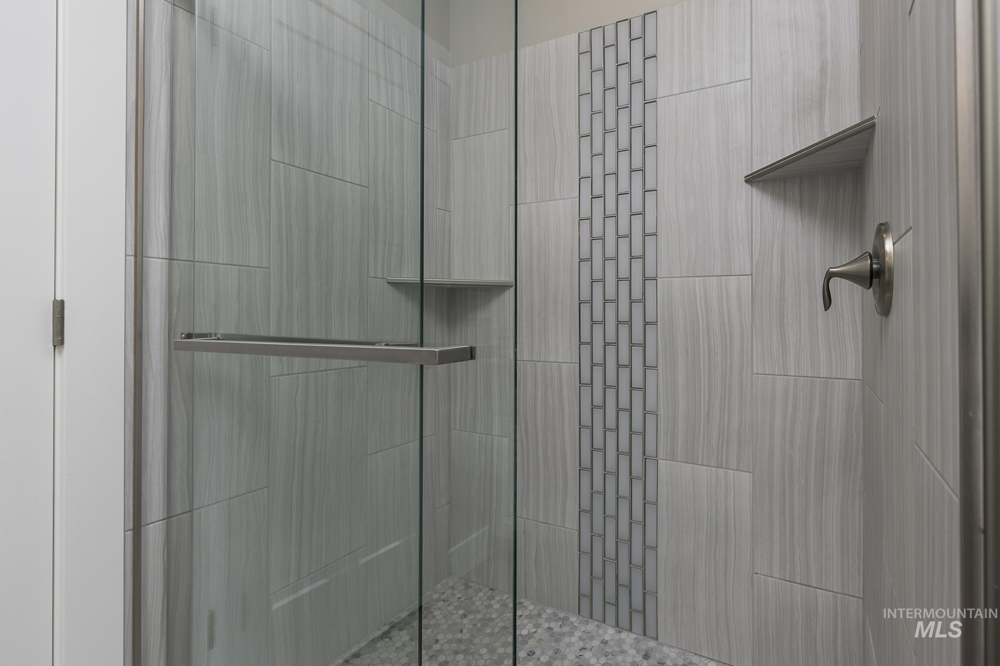 Full bath with a shower stall