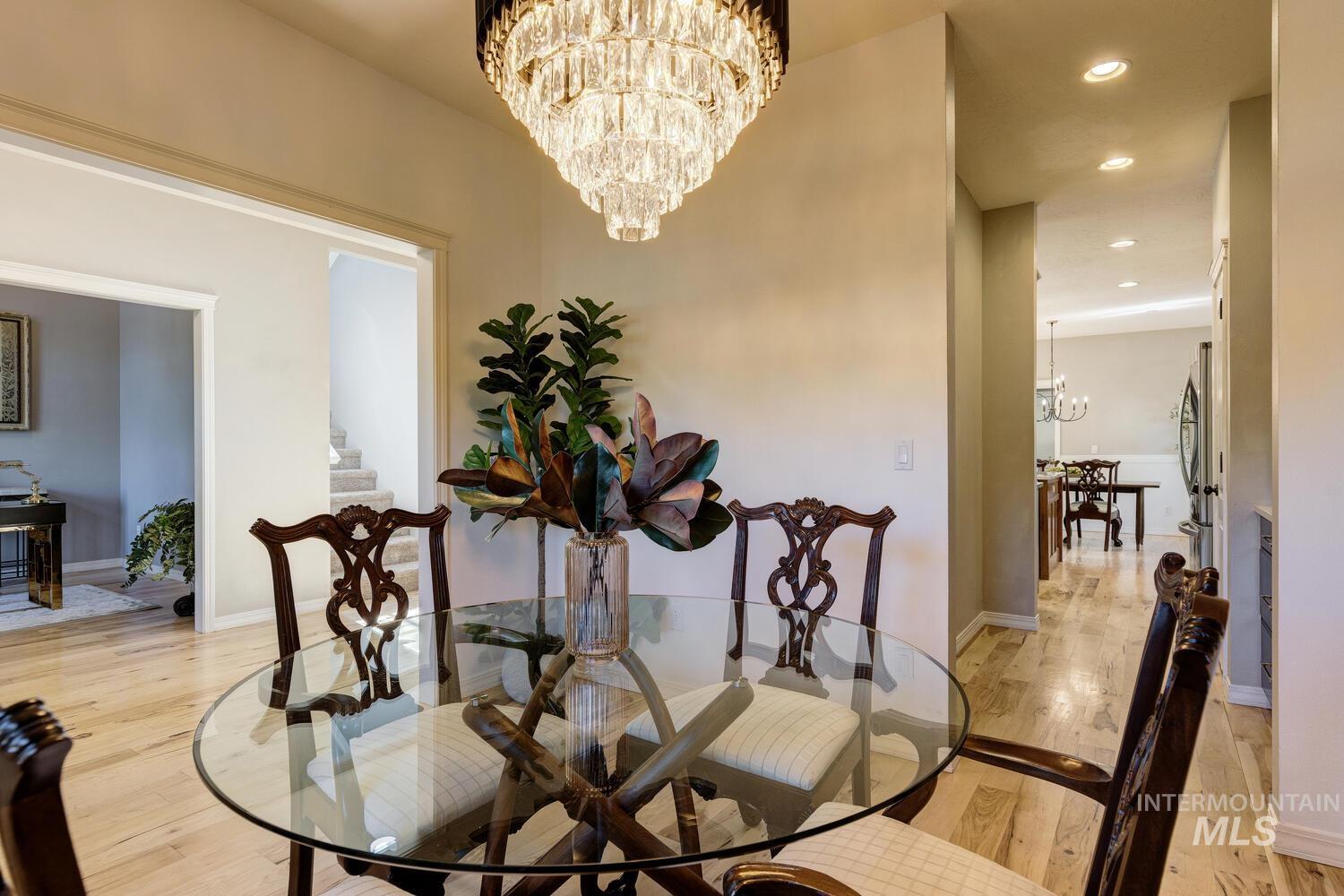 Dining space featuring a chandelier, recessed lighting, and light wood-style floors