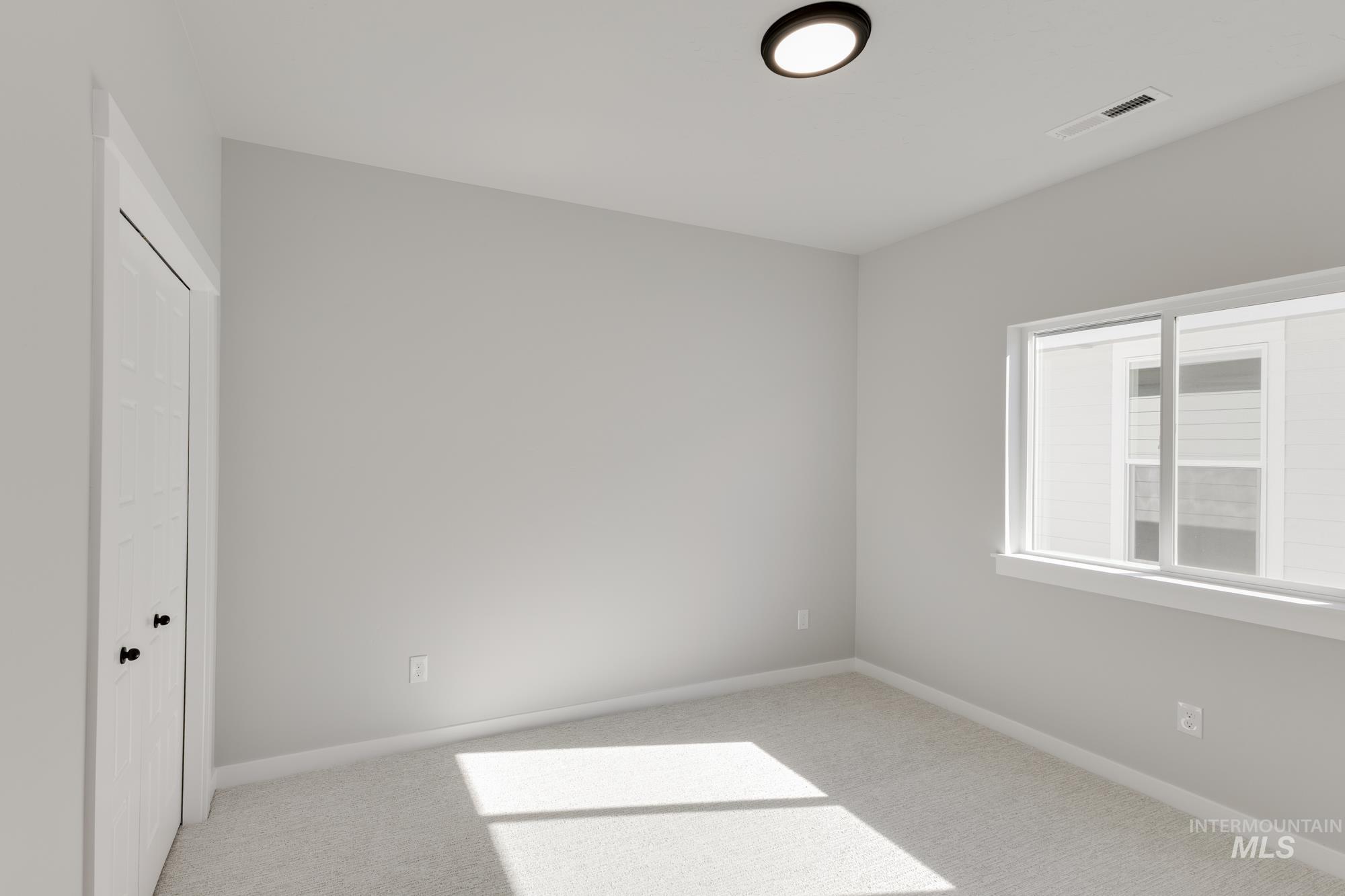 Unfurnished bedroom featuring a closet and carpet