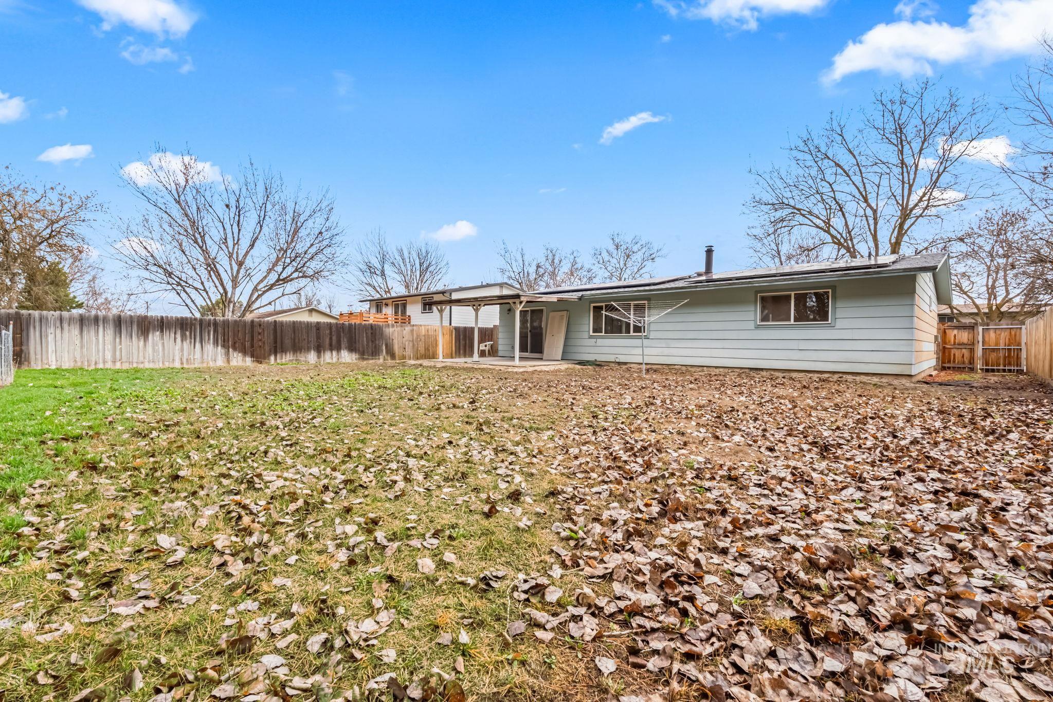 Back of house featuring a patio area and a fenced backyard