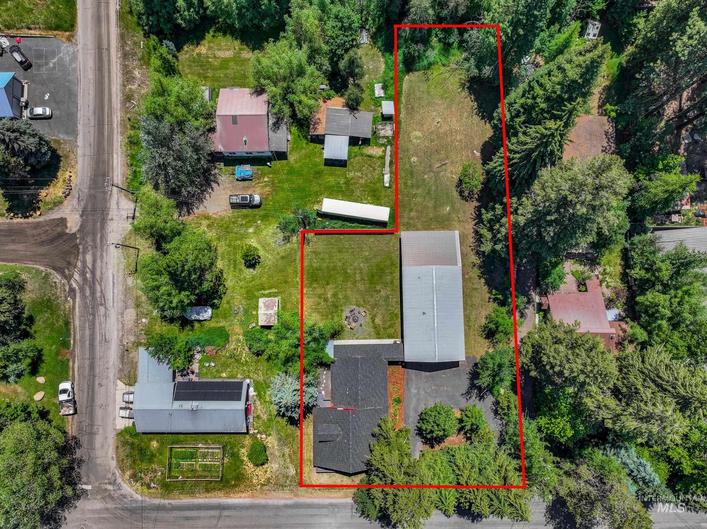 Aerial overview of property's location featuring property parcel outlined
