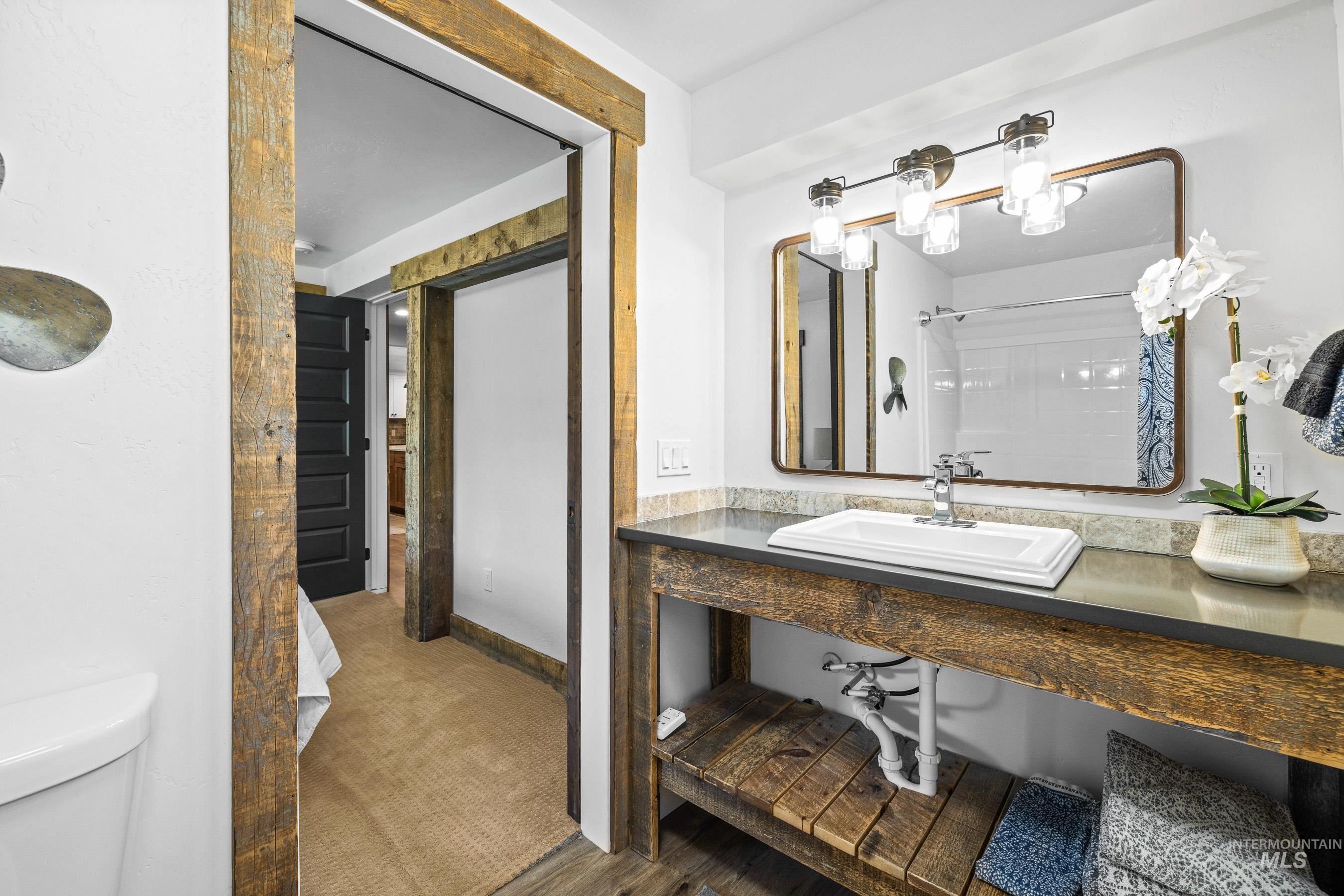 Full bath featuring a sink and curtained shower