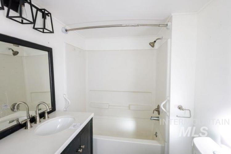 Full bathroom with vanity and  shower combination