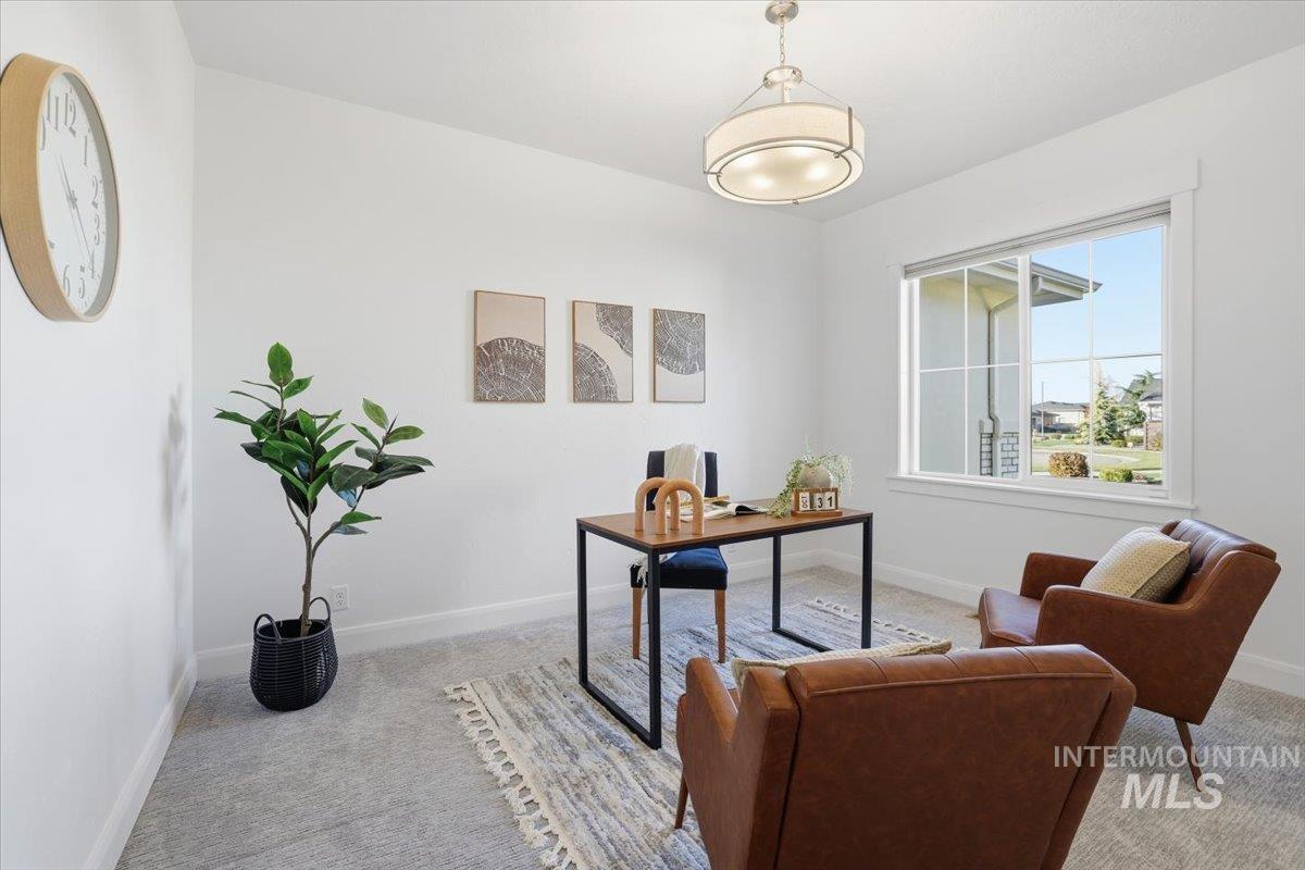 Office area featuring baseboards and carpet flooring