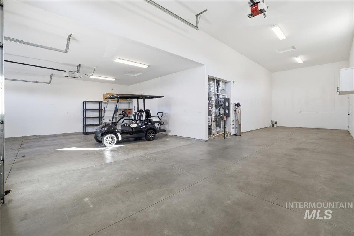Garage featuring a garage door opener