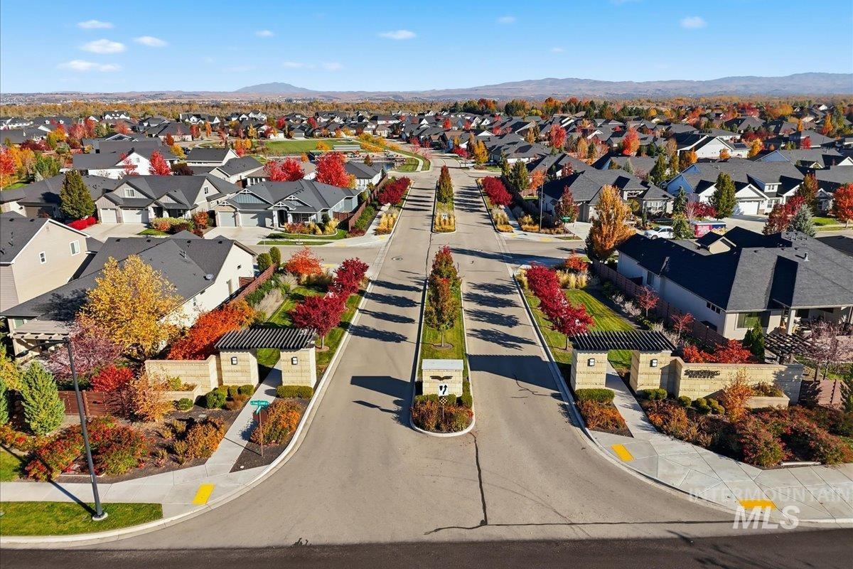 Aerial perspective of suburban area with a mountain backdrop