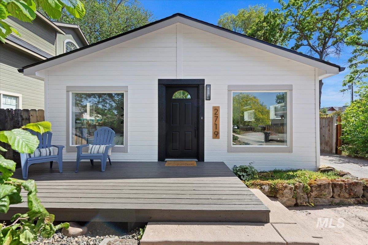 Property entrance with a wooden deck