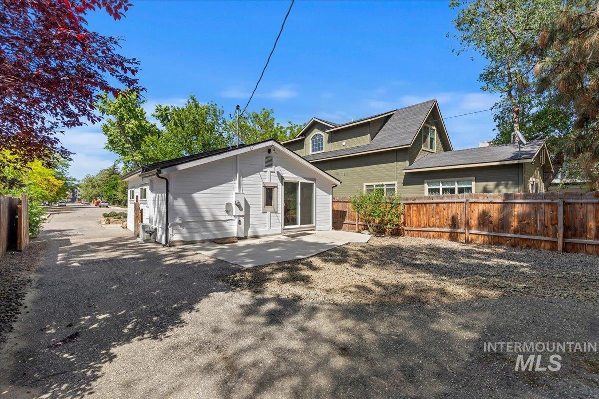 Back of house featuring a fenced backyard and a patio area