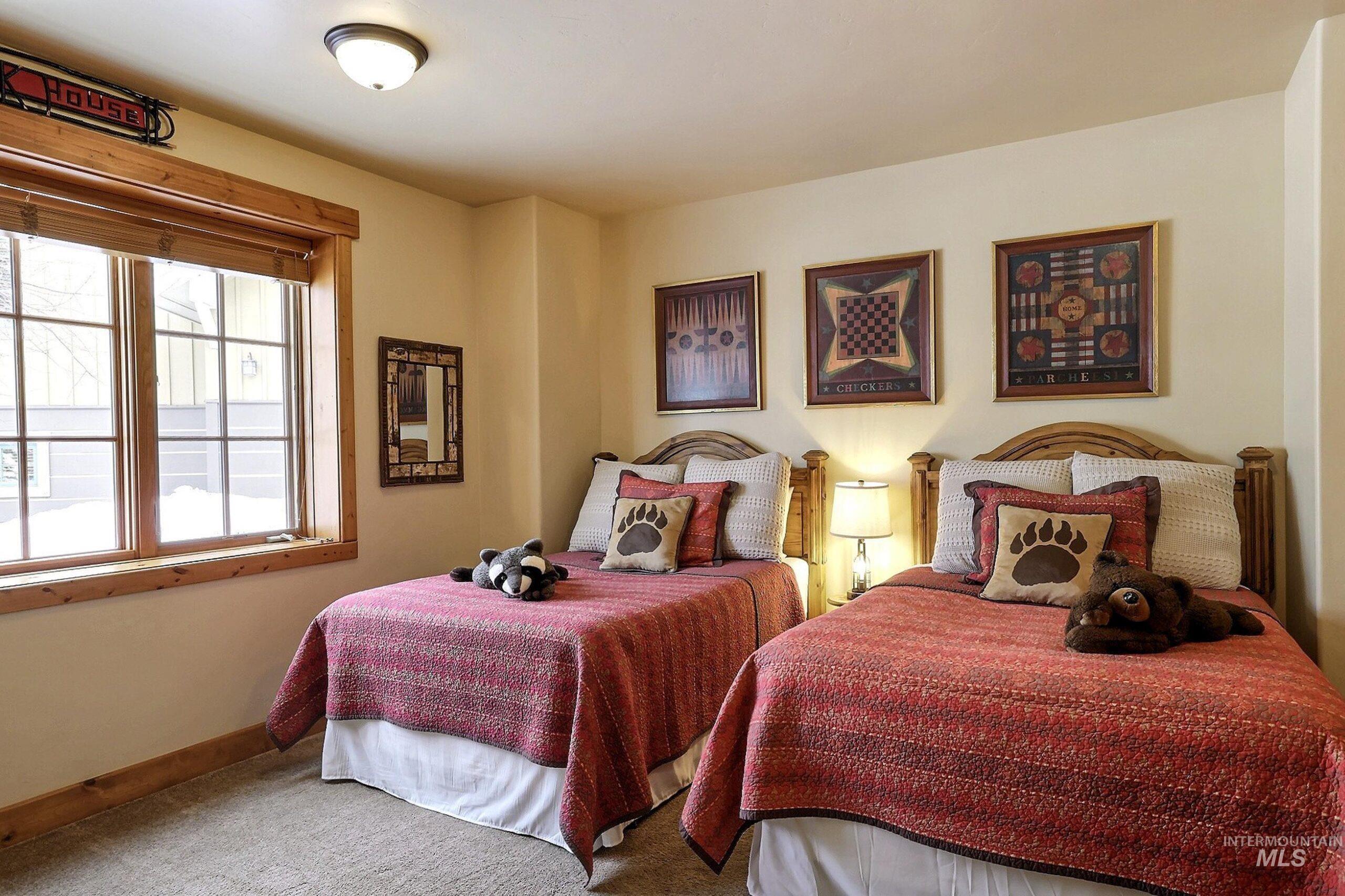 Carpeted bedroom featuring baseboards