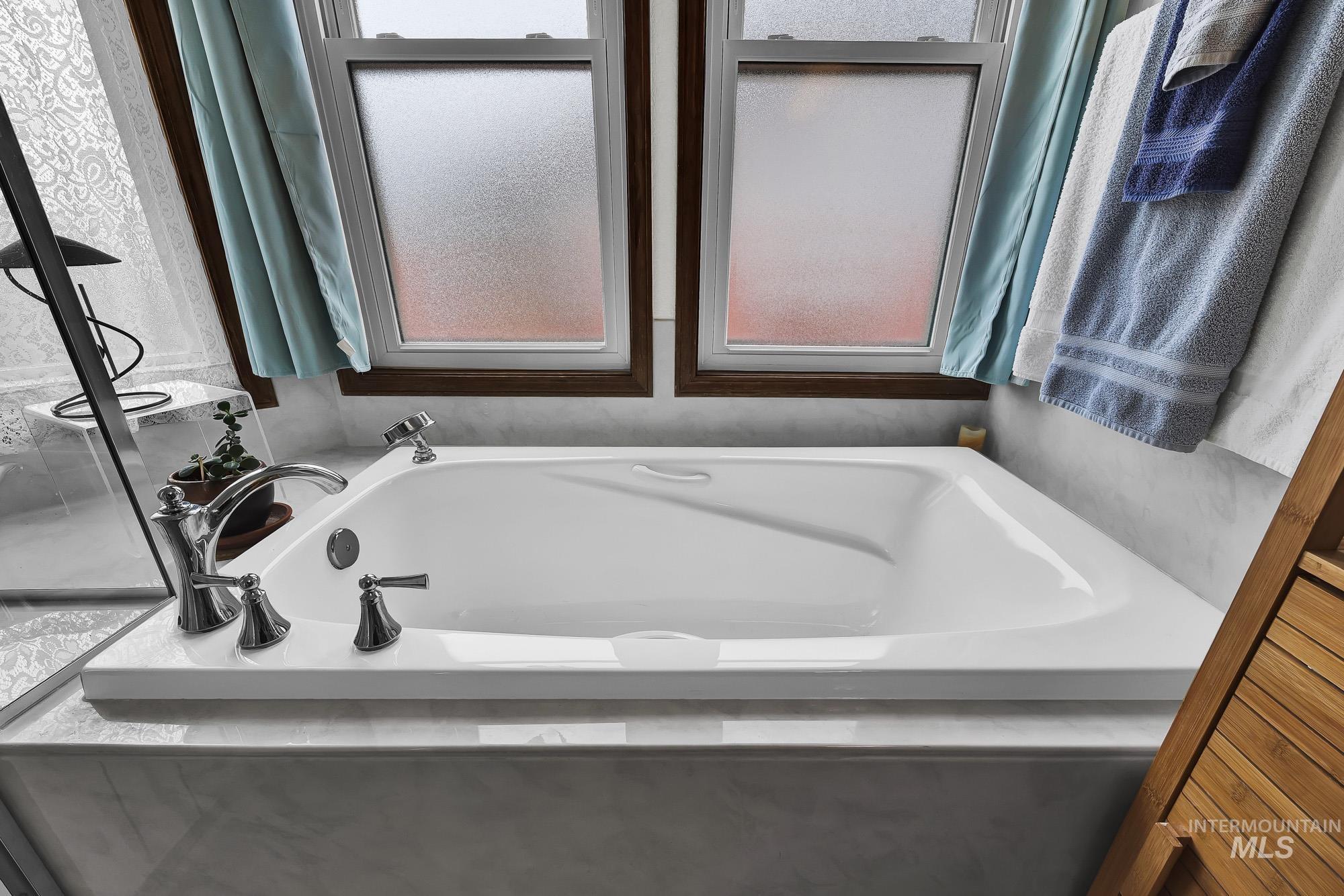 Full bath featuring a bath