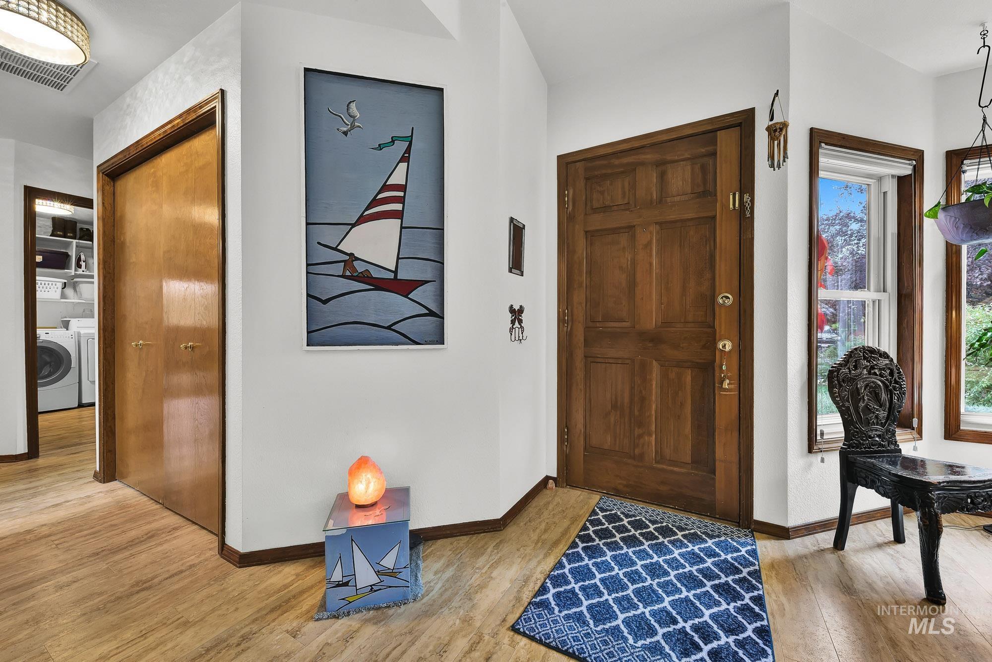 Entryway with light wood-type flooring