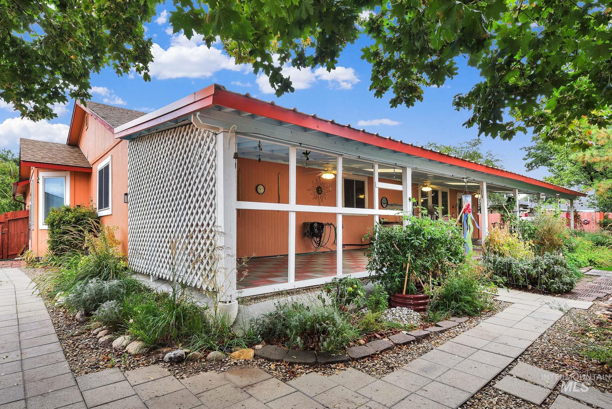 View of property exterior featuring a ceiling fan and a shingled roof