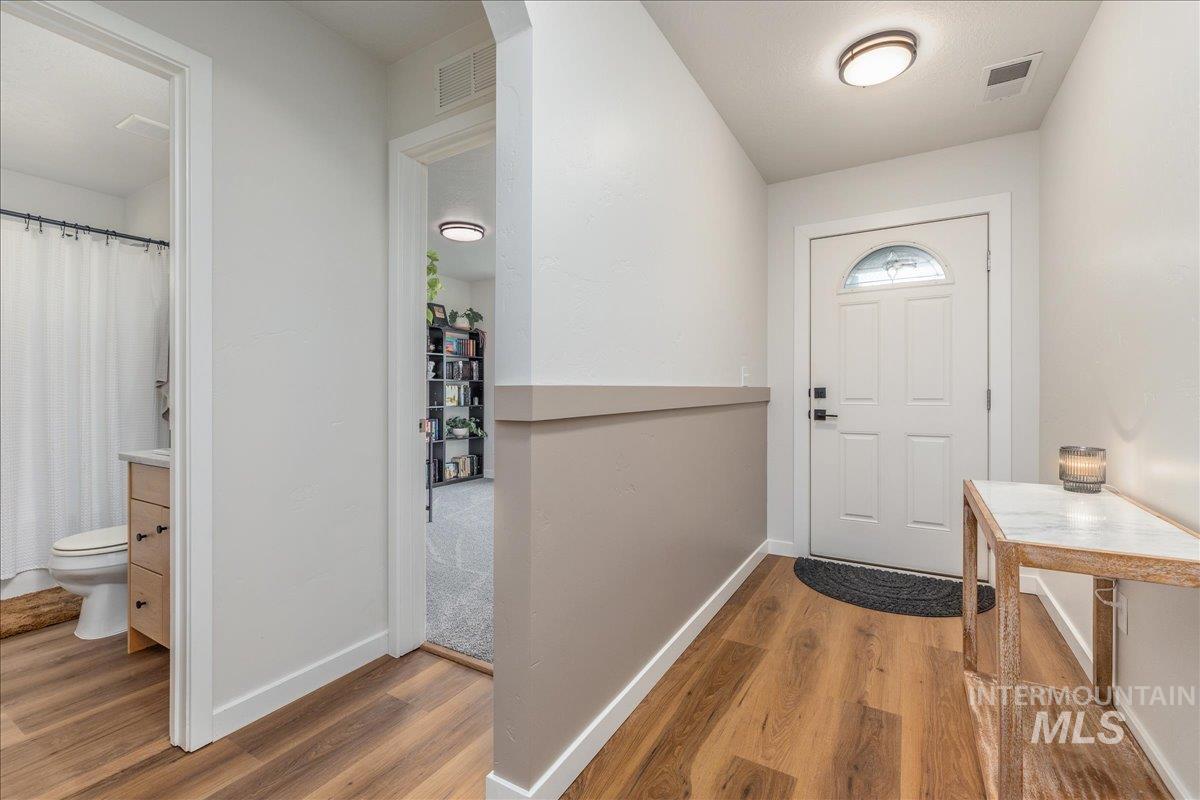 Doorway with wood finished floors
