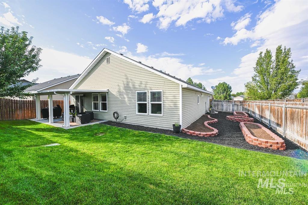 Back of house featuring a patio and a fenced backyard
