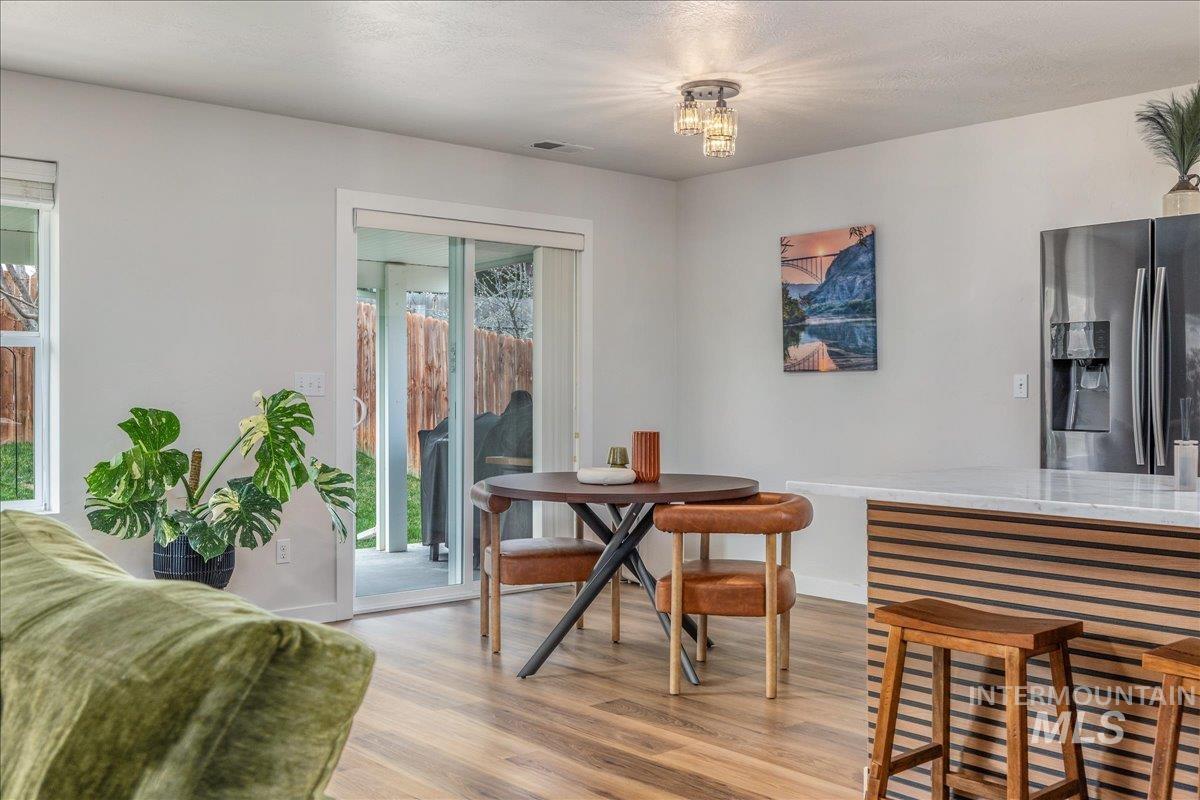 Dining area featuring light wood finished floors and baseboards