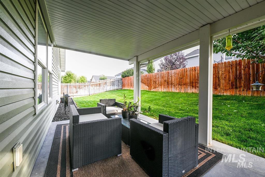 Fenced backyard with a patio area and an outdoor lounge area